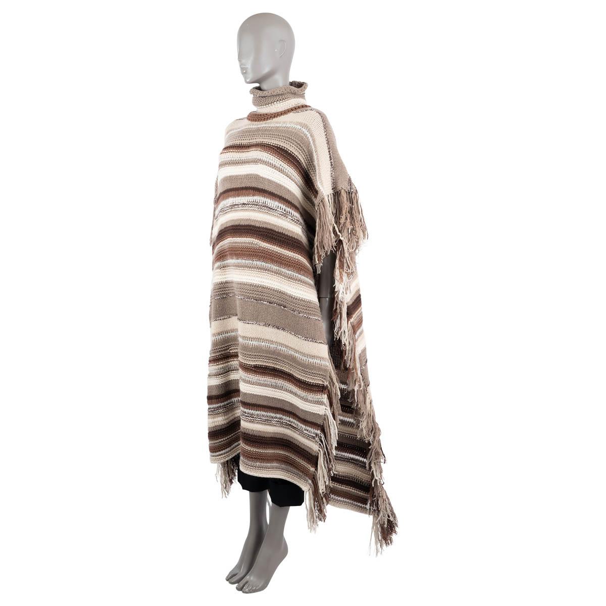 100% authentic Chloé oversized striped knit poncho in brown, taupe, ivory and sand cashmere (93%), wool (5%), alpaca wool (1%) and polyamide (1%). The design features fringed trims and is made of mid-weight knit. Unlined. Has been worn and is in