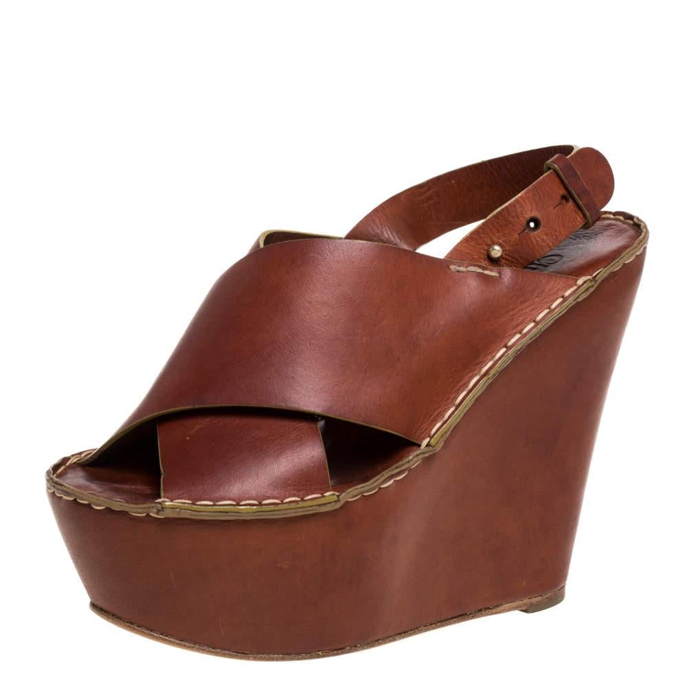 Wear them through the day or dress them up for day time parties, these Chloe sandals are stylish and comfortable. With brown leather criss-cross straps on the vamps and slingbacks on the ankles, these shoes feature high platforms and wedges that