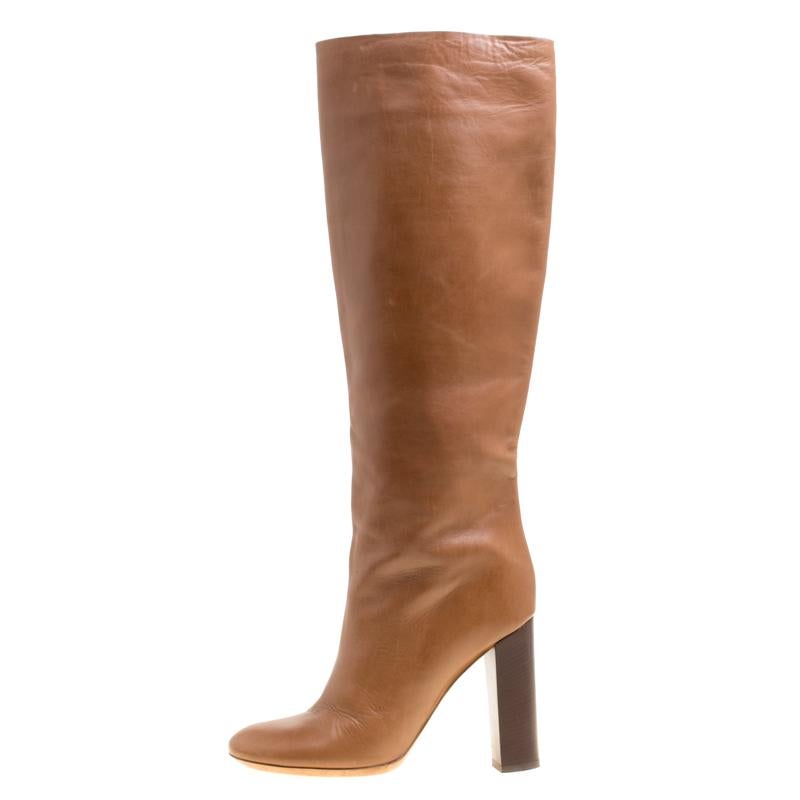 Creations as fashionable as this pair of knee high boots from Chloe deserves to be in every woman's closet. They've been created from leather, shaped as round toes and balanced on block heels.

Includes: Packaging

Size: 39

