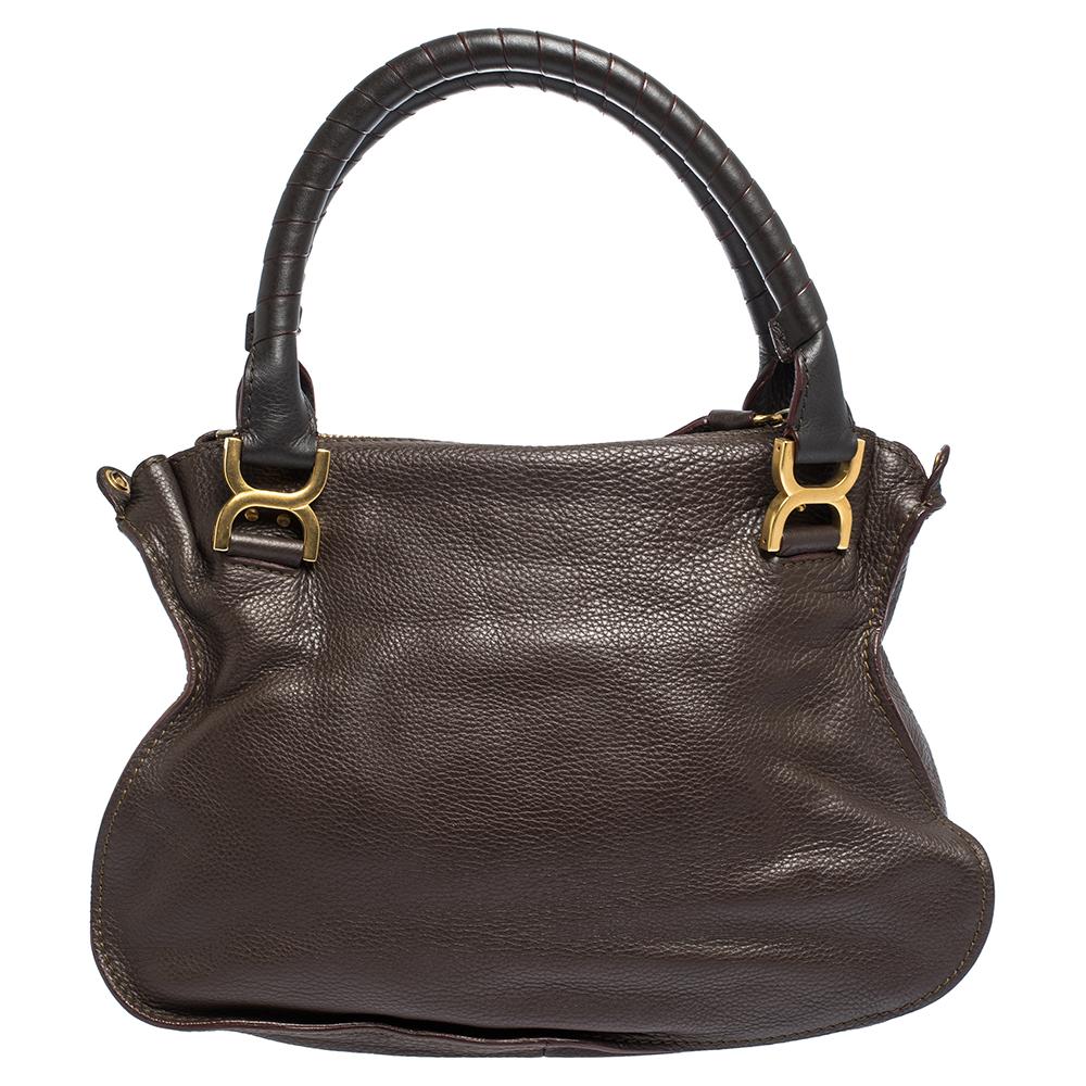 Stunning to look at and durable enough to accompany you wherever you go, this Chloe satchel is a joy to own! This Marcie bag is crafted from quality brown leather with dual handles and a well-designed front exterior enhanced with stitch detailings