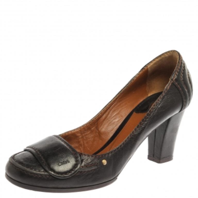 These brown pumps from Chloe are a smart pick for everyday use or for a special occasion. They are crafted from leather and feature round toes with a strap detailing on them. They are equipped with comfortable leather-lined insoles and elevated on 7