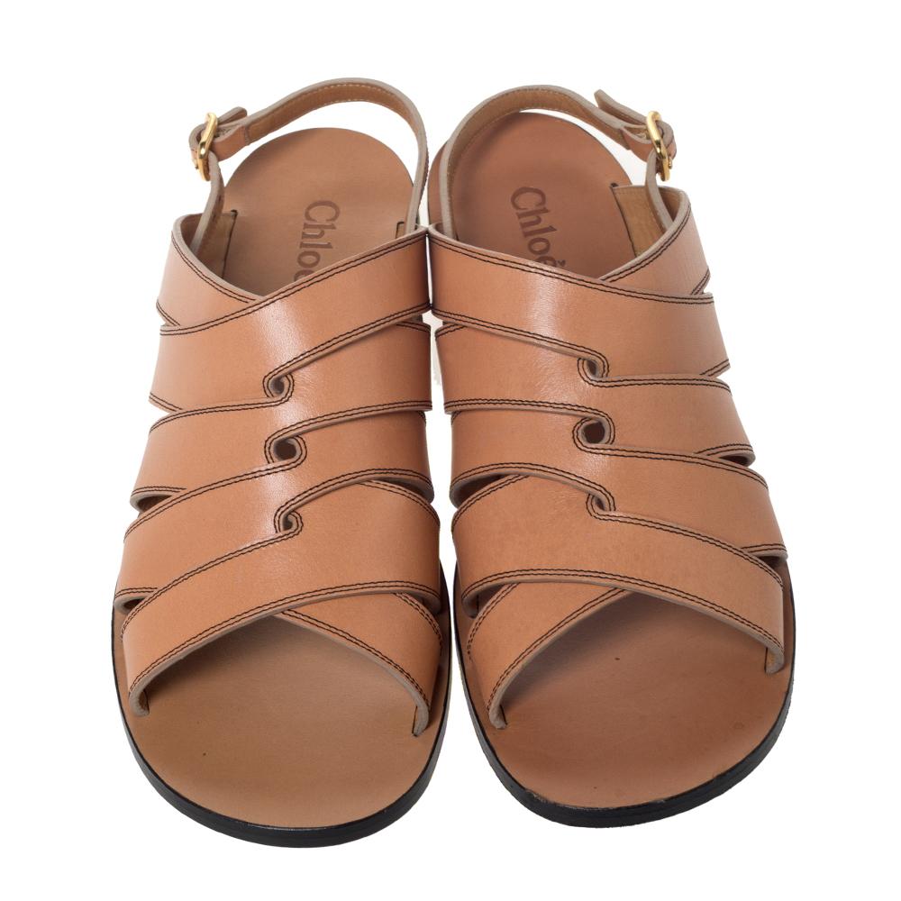 You'll love flaunting these sandals from Chloe as they are stylish and comfortable. Crafted from brown leather, they flaunt multiple straps on the vamps, open toes and buckled slingbacks at the ankles. They'll look perfect with dresses and