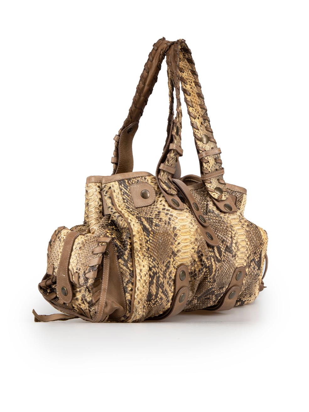 CONDITION is Good. Minor wear to bag is evident. Light wear to the snakeskin with general peeling of the scales due to age, scratches to the metal feet at the base and marks to the lining on this used Chlo√© designer resale item.
