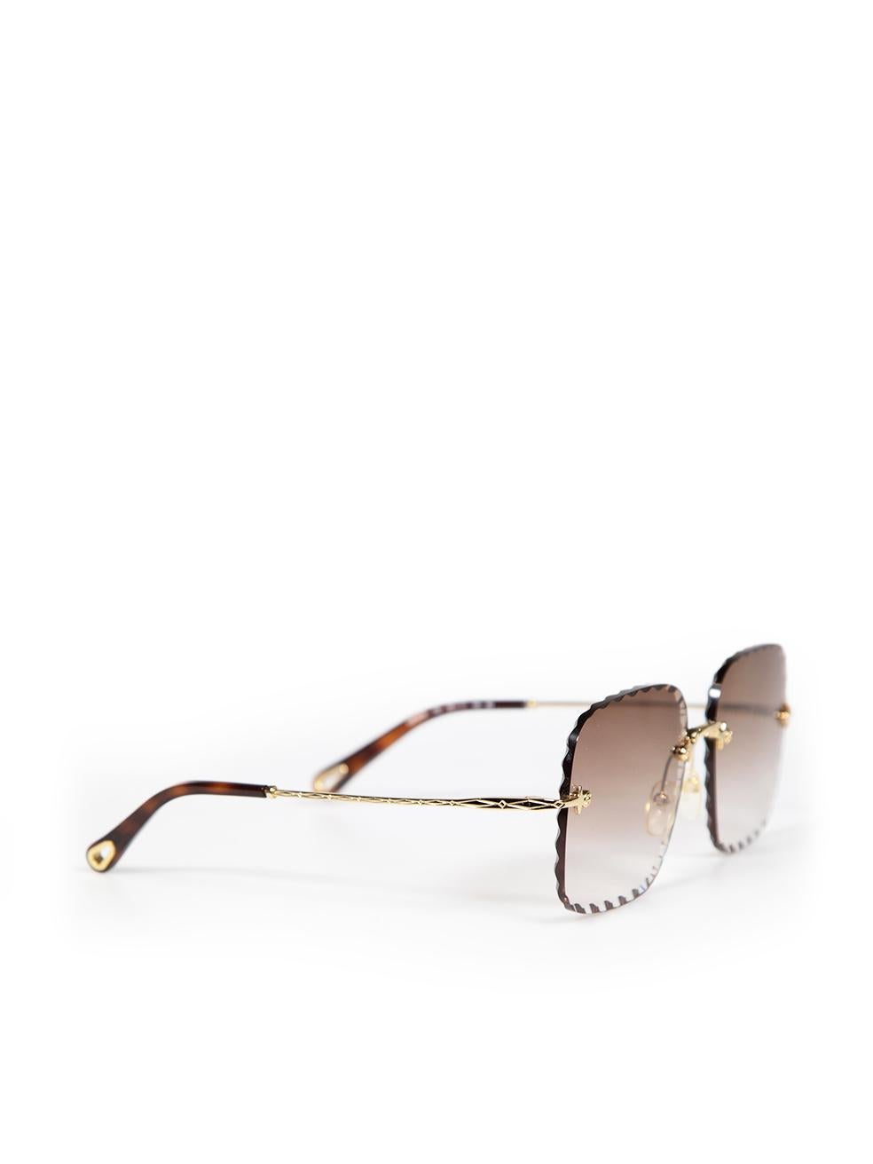 CONDITION is Very good. Hardly any visible wear to sunglasses is evident on this used Chloé designer resale item. This item comes with the original case and box.
 
 
 
 Details
 
 
 Brown
 
 Metal
 
 Sunglasses
 
 Rimless
 
 Scalloped edge
 
 Brown