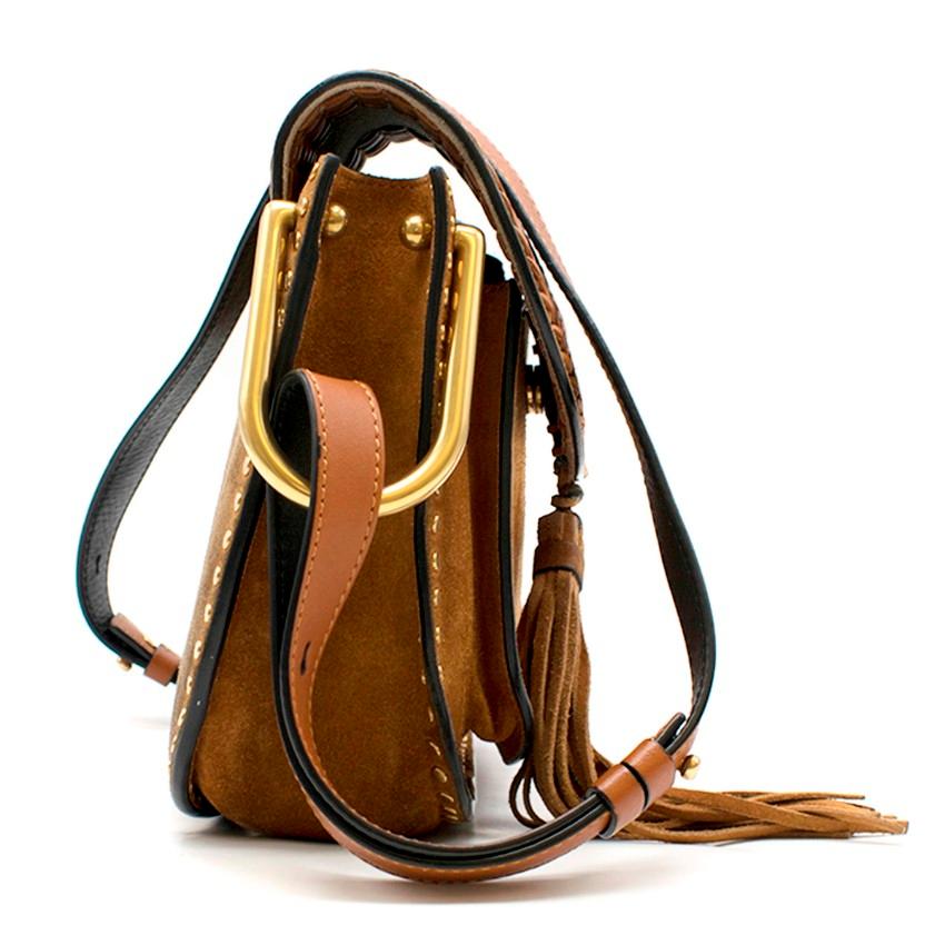 Chloe Brown Suede Small Hudson Bag

-Brown whipstitched suede bag
-Flap bag with tassel
-Gold tone popper closure
-One main pocket with two smaller pocket
-Gold tone hardware
-Adjustable shoulder strap

Please note, these items are pre-owned and may