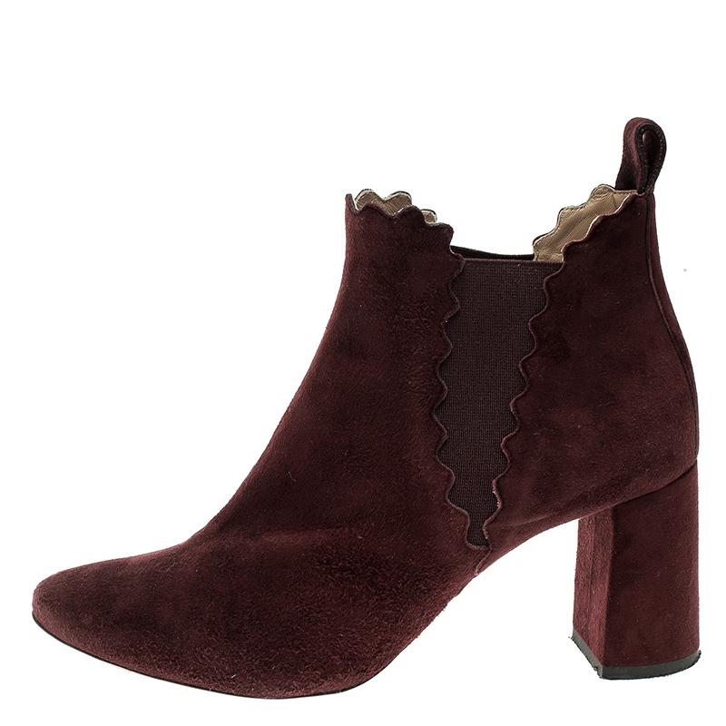 A blend of style and bold simplicity, these Lauren ankle boots from Chloe will sweetly complement your casual as well as evening ensemble. Crafted with deep burgundy suede, the boots are characterized by the interesting scalloped detail adorning the