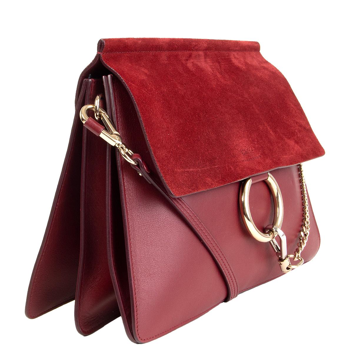 Chloé 'Faye Medium' shoulder bag in burgundy suede and calfskin. Closes with a magnetic-snap under the flap. Open pocket under the flap. Unlined with a zipper pocket against the back. Has been carried and is in excellent condition with some faint