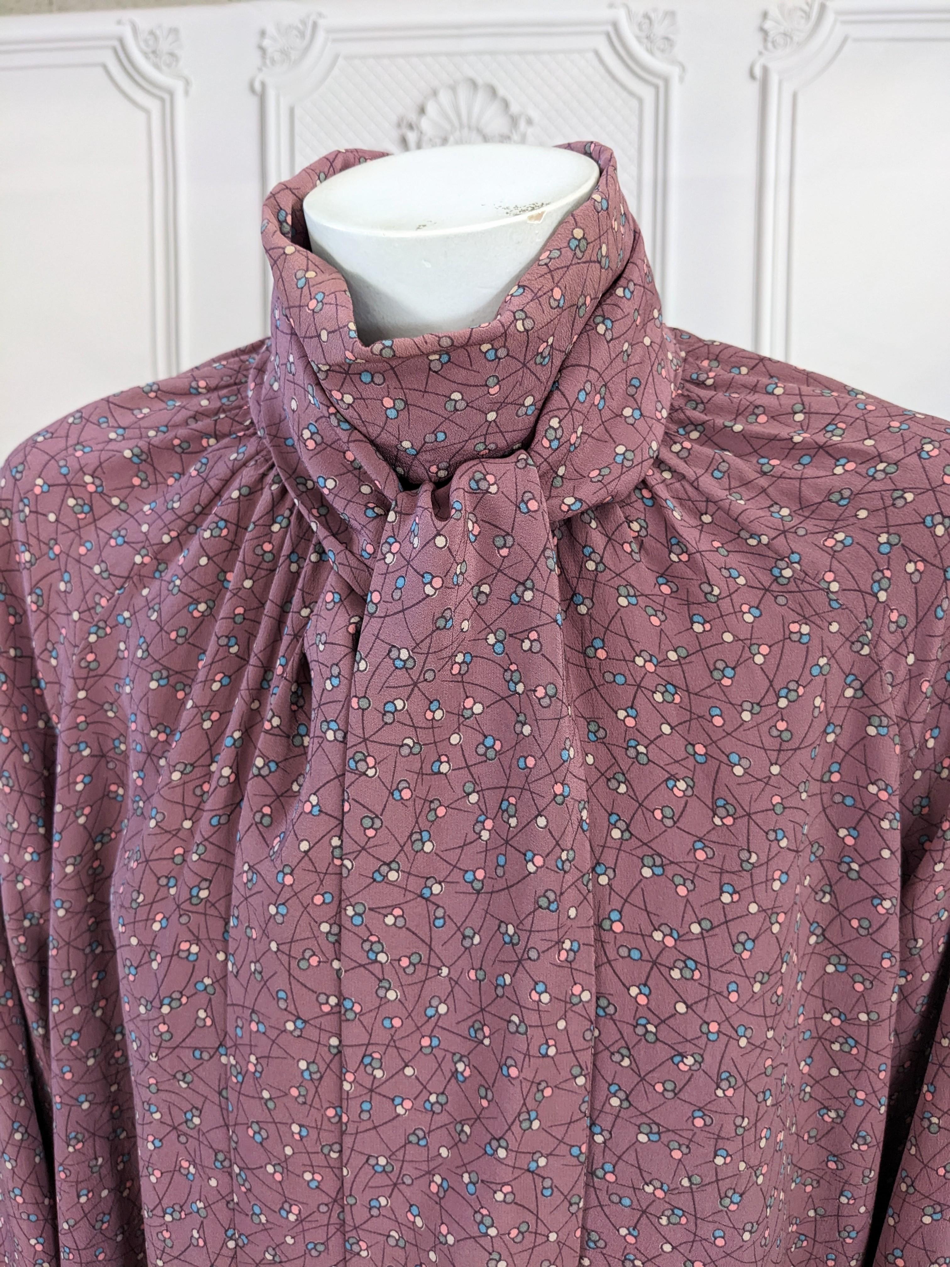Chloe by Karl Lagerfeld Bow Tied Poets Blouse in blueberry floral Japonesque printed silk crepe. High double wrapped tie closes with a bow at front gathered neckline and huge gathered sleeves with an unusual split buttoned cuff. Very 18th Century