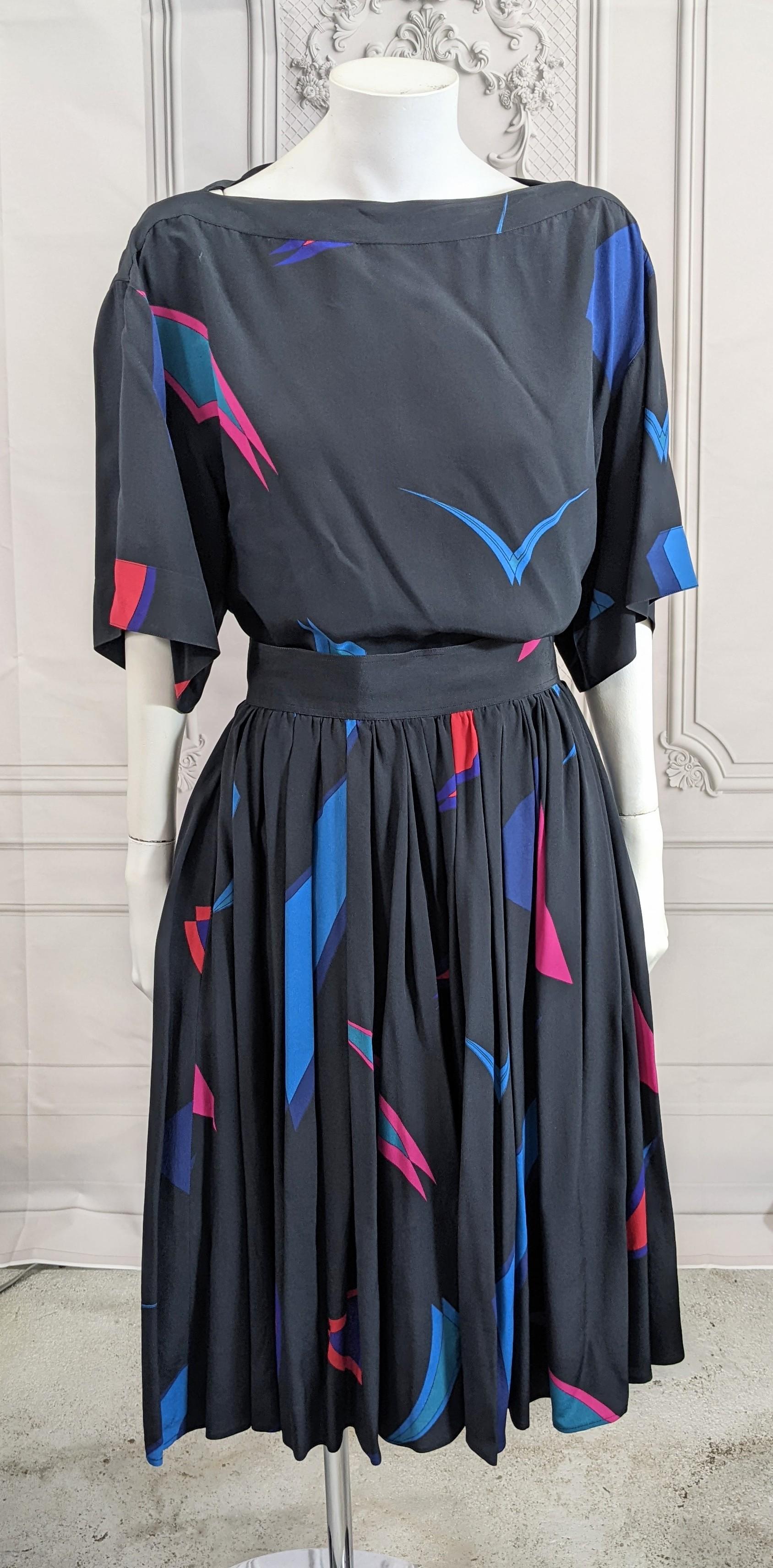 Lovely Chloe by Lagerfeld Silk Crepe Culotte Set from the late 1970's. Printed Bateau neck full T shirt with full gathered skirt which are actually shorts. Wonderful Deco inspired print on navy silk crepe de chine. Back zip and hook entry.
Work very