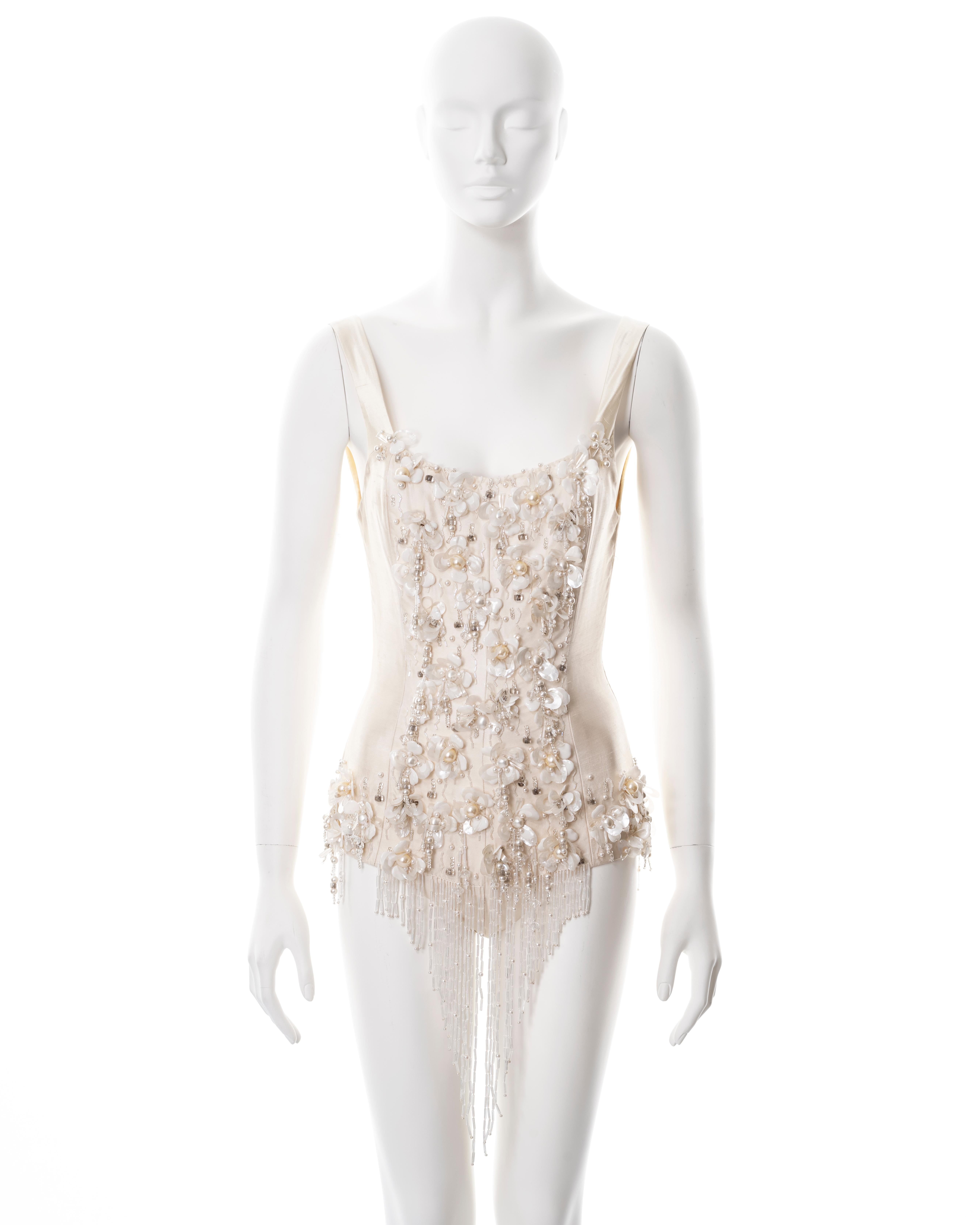 ▪ Chloé showpiece bodysuit
▪ Designed by Martine Sitbon
▪ Sold by One of a Kind Archive
▪ Spring-Summer 1991
▪ Constructed from ivory raw silk 
▪ Floral embellishments of petal-shape paillettes, faux pearls, bugle and clear beads
▪ Size approx. FR