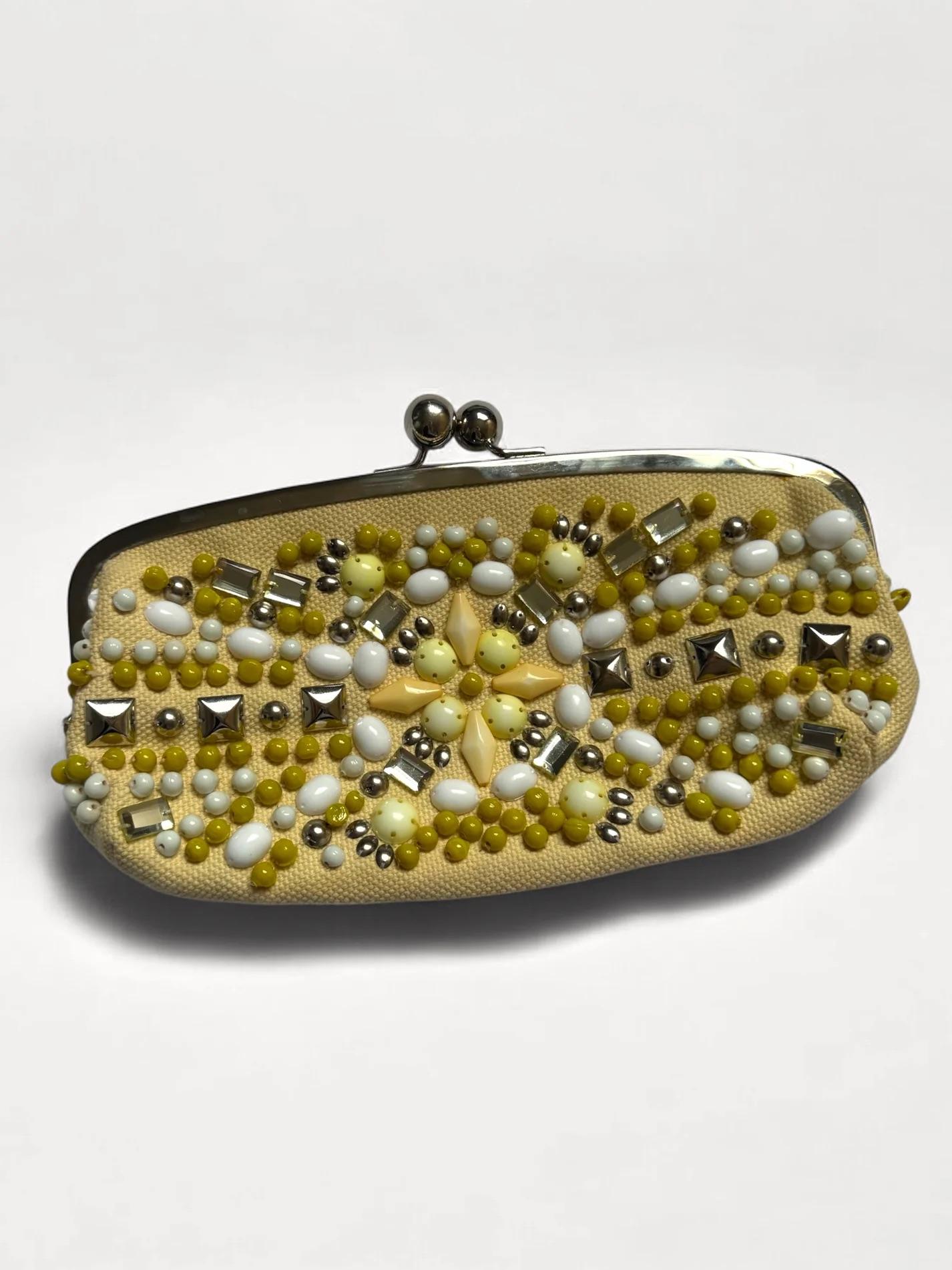 Chloé by Phoebe Philo yellow beaded clutch bag, Spring Summer 2002
Textured cotton canvas
With original dust bag
Good overall condition with some discolouration to reverse
10.5” x 5.5”