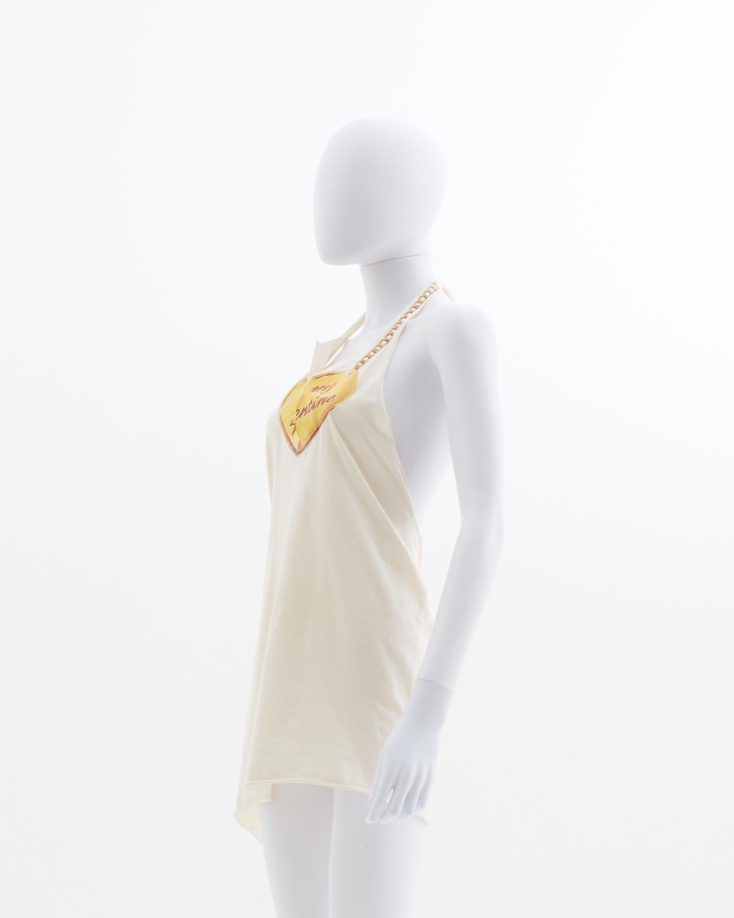 - Designed by Phoebe Philo 
- Sold by Skof.Archive 
- New with original tag
- V-neck cut row in the middle with a yellow printed heart 
- Open back 
- Adjustable American neckline 
- Spring Summer 2002

Size : 
FR 36 - IT 40 - UK 8 - US 4
