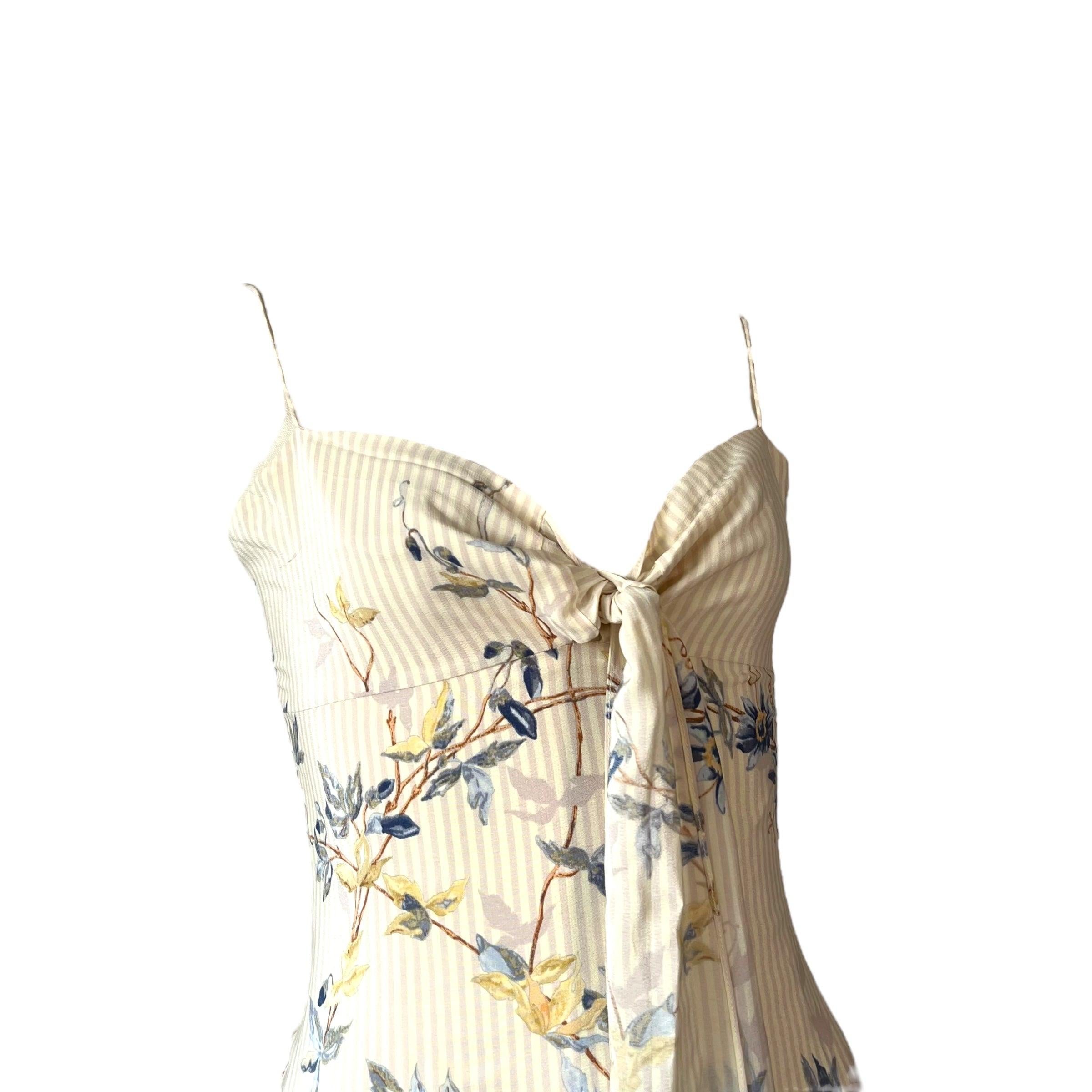 A rare and collectible piece from Stella McCartney’s debut collection for Chloé in 1998, this airy mini dress captures the youthful, feminine spirit she brought to the house. Made from lightweight crinkled fabric with a soft floral print, it