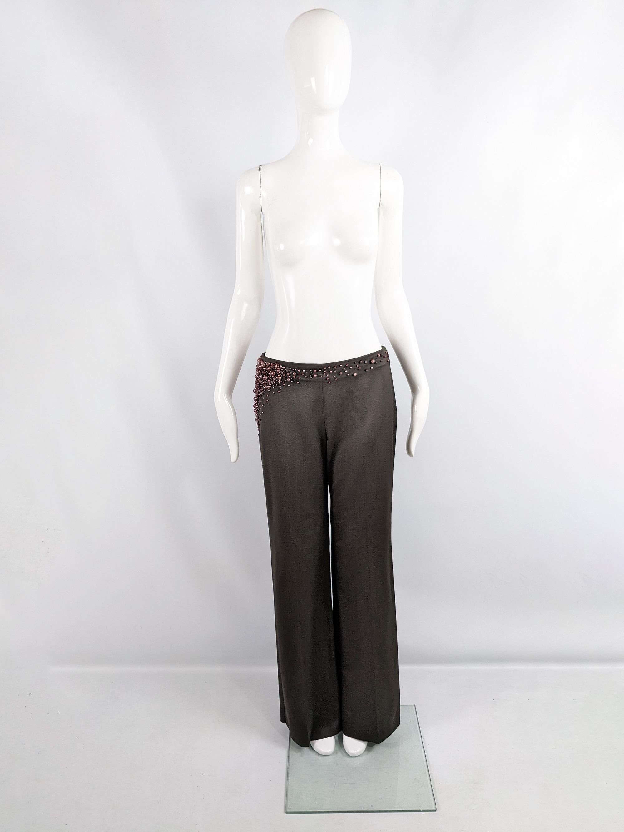 An incredible pair of vintage Chloé trousers from the Autumn Winter 2001 collection, designed by Stella McCartney. In a dark grey wool blend fabric with the tiniest hint of brown (called Café by Chloé). It has amazing pink beading smattered around