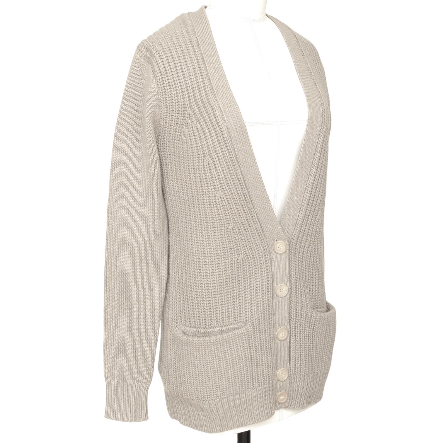 GUARANTEED AUTHENTIC CHLOE 2011 V-NECK CASHMERE SWEATER

Retail excluding sales taxes, $895

Details:
- Beige long sleeve cardigan has a great easy fit.
- Deep v-neck, button closure.
- Front dual pockets.
- Long sleeve.
- Easy great piece for your