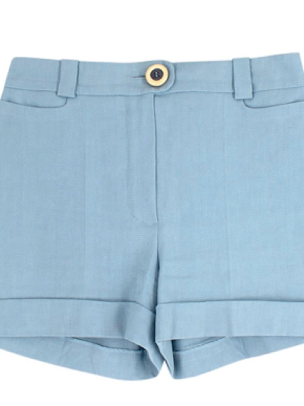 Chloé Powder Blue Tailored Shorts

- Power blue, cotton tailored Chloé shorts
- Cream, shell fabric centre button
- 2 front pockets, and 2 illusion pockets on back
- Belt loops around waistband

Materials:
100% Cotton
Shell

Made in France
Dry-clean