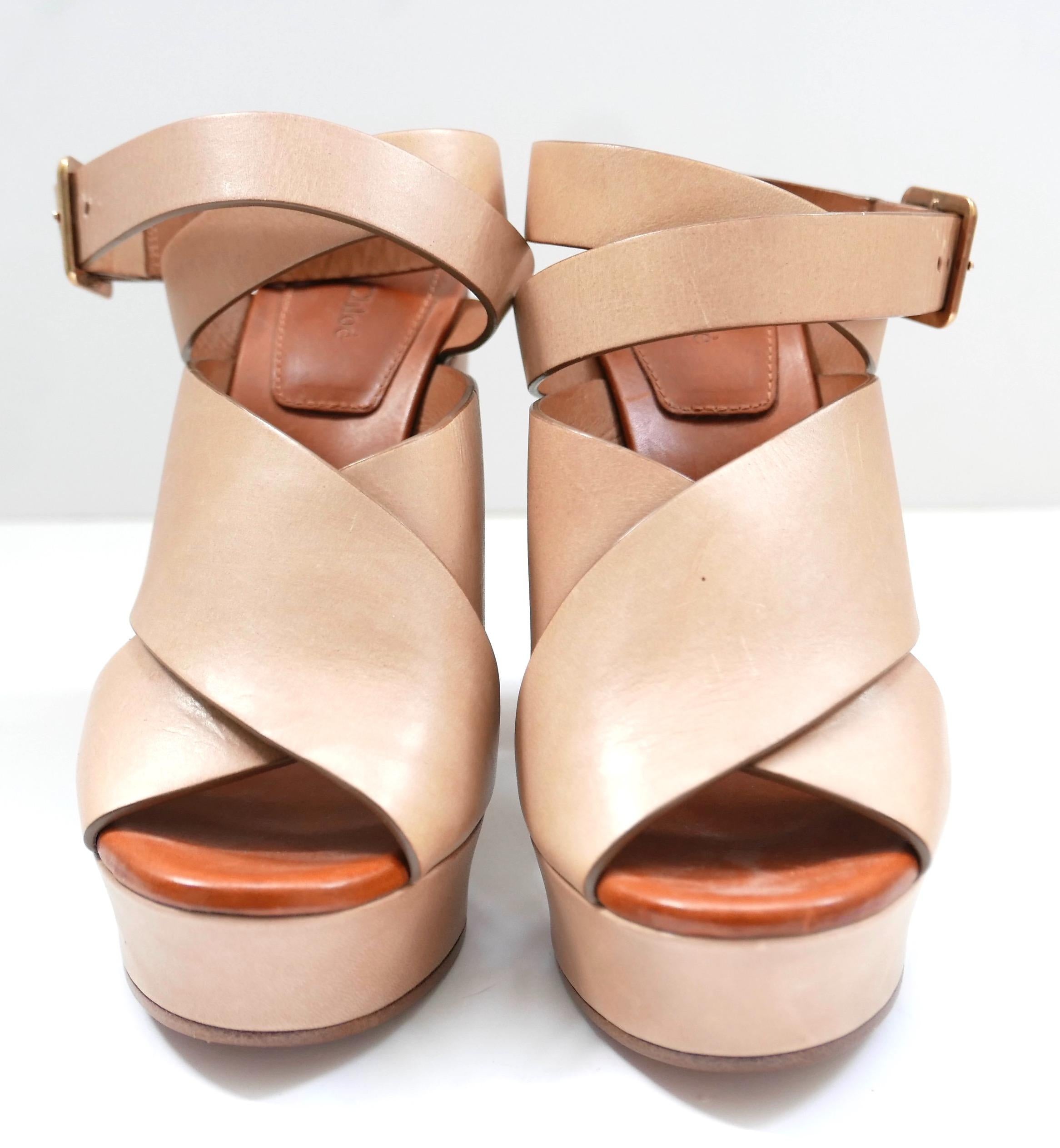 Iconic Chloe chunky strap, block heel sandals. Unworn with 1 x dustbag. Made from thick camel coloured leather, they have brass ankle buckles, contrast padded footbeds and platform fronts. Size 36. Measures approx - 9.5” heel to toe, heel 4.25”,