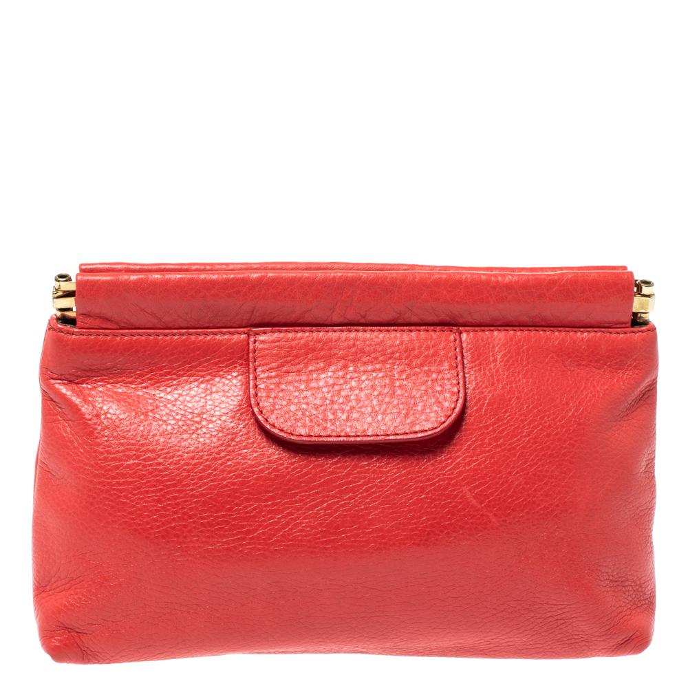 Every feature on this Chloe clutch is delighting which makes the creation worthy of being owned. It has been crafted from quality leather and styled with a bow in the front. The striking coral orange hue will make sure you are the center of