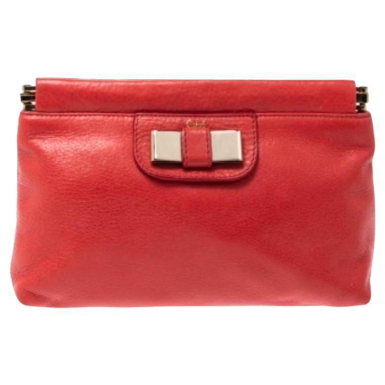 Pochette Chloe con fiocco in pelle arancione corallo