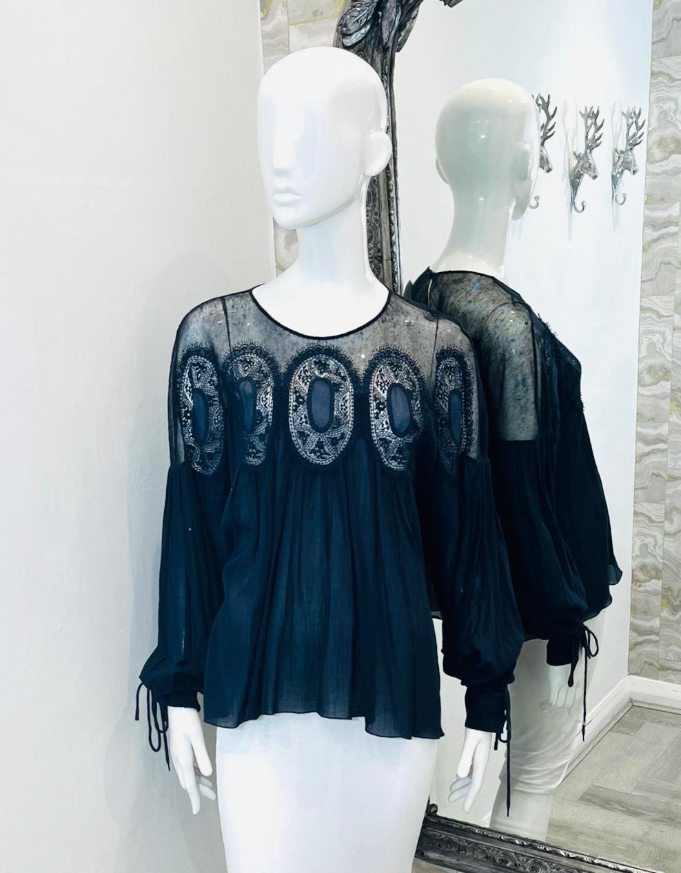 Chloe Cotton & Linen Blouse

Navy sheer blouse designed with lace and crochet detailing.

Featuring long, balloon sleeves with self-tied cuffs.

Styled with round neckline, key-hole closure to rear and loose-fit silhouette.

Size – 40FR

Condition –