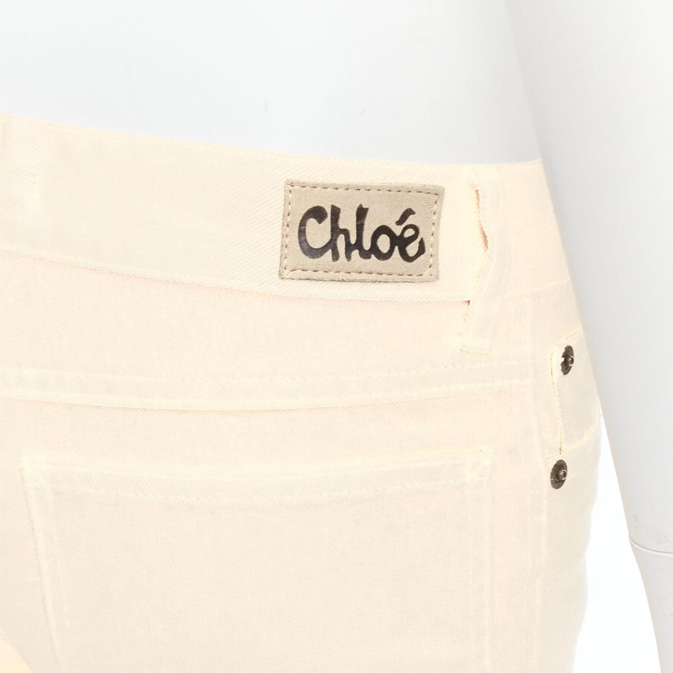 CHLOE cream cotton blend panelled cuff hem flared jeans FR34 XS
Reference: LAYU/A00017
Brand: Chloe
Material: Cotton, Blend
Color: Cream
Pattern: Solid
Closure: Zip Fly
Extra Details: Logo back.
Made in: Italy

CONDITION:
Condition: Very good, this