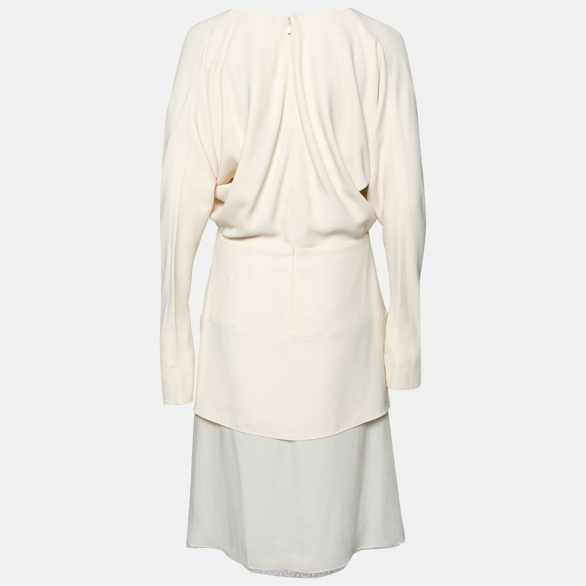 Spring into style with this gorgeous wrap dress from Chloe. The cream dress has been beautifully stitched using crepe and chiffon and comes with a layered style. Make a refreshed start to summer by wearing this long-sleeved, fashionable piece.

