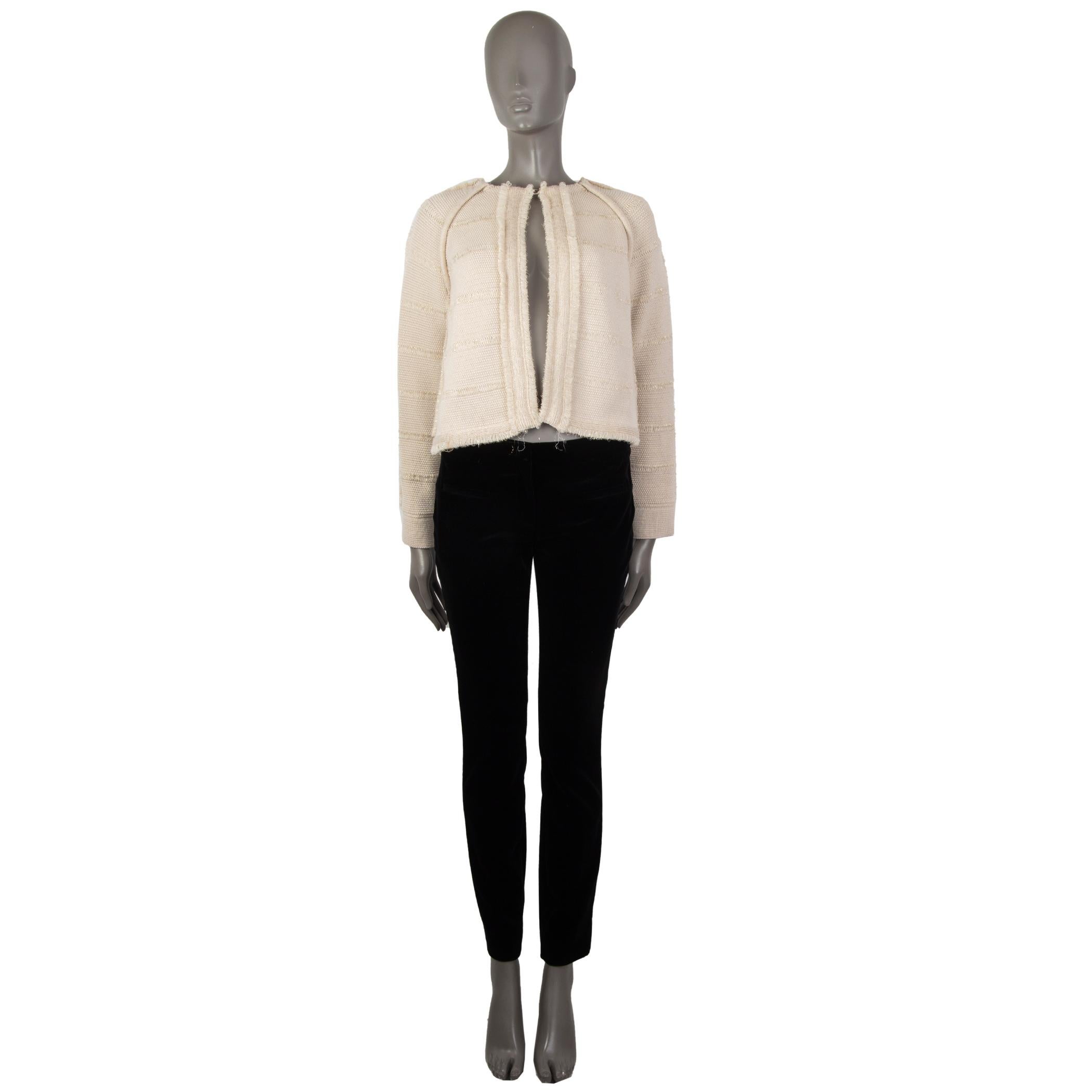 authentic Chloé fringe-trim lamé cardigan in cream and gold wool (68%) viscose (26%) polyester (6%) with raglan sleeves, round collar, long sleeves, detailed with loose loops allover and along the trim. Closes with one button in the front. Unlined.
