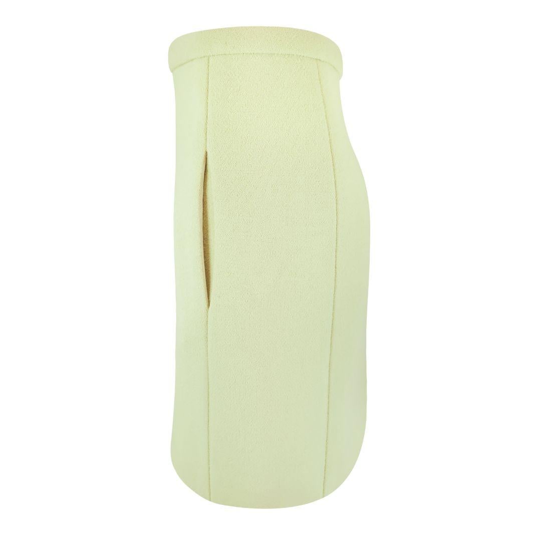 Chloe knee length skirt in pale citrus green with structured A-line silhouette. Crepe wool fabric, concealed side pockets sewn into the side seams, concealed center back zipper.

Condition Details: Excellent, gently used condition. No stains or