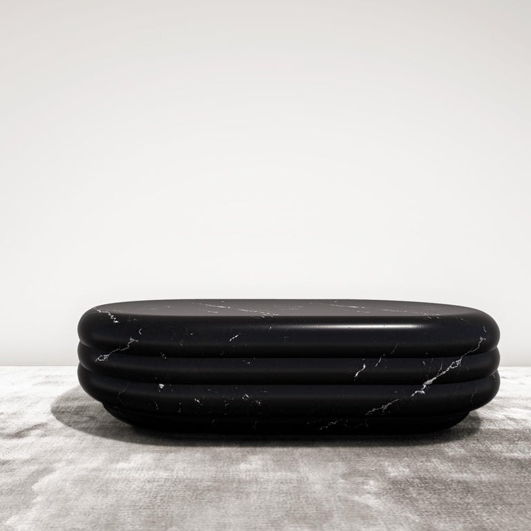 In ancient Rome and Greece figures of divinities were sculpted in marble and so is this modern-day coffee table inspired by bodily curves. Carved from a solid block of marble, the voluptuous silhouette and silky honed surface of the oval shape