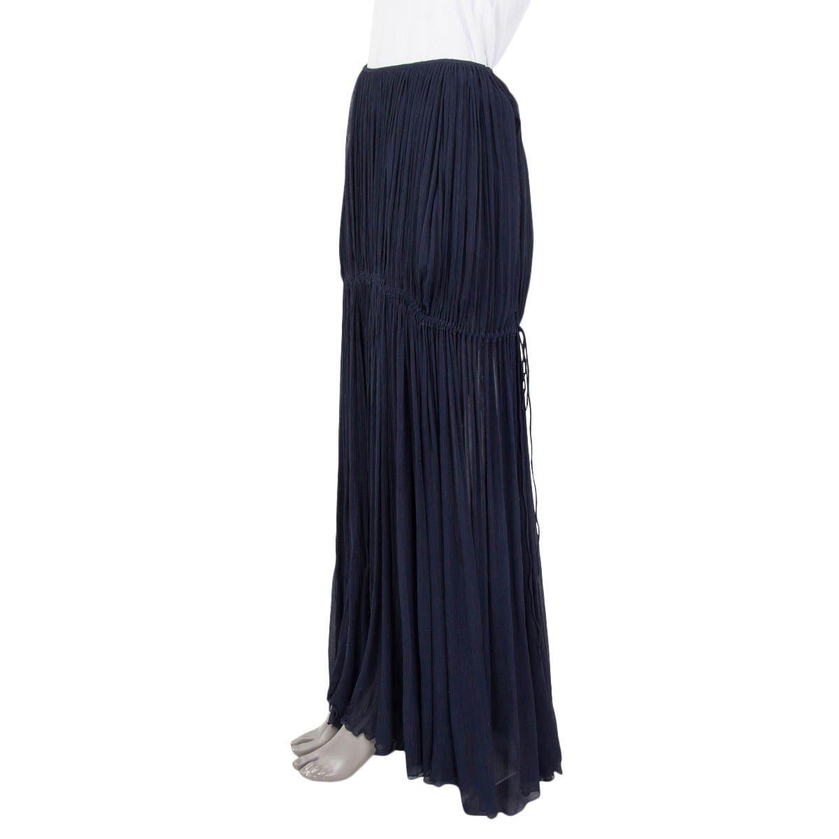 100% authentic Chloé Ruffled Chiffon Maxi Skirt in deep navy silk (100%). Opens with a zipper on the side and is lined with a short mini skirt in deep navy Silk (100%). The flared skirt has an adjustable drawstring detail around the hips. Has been