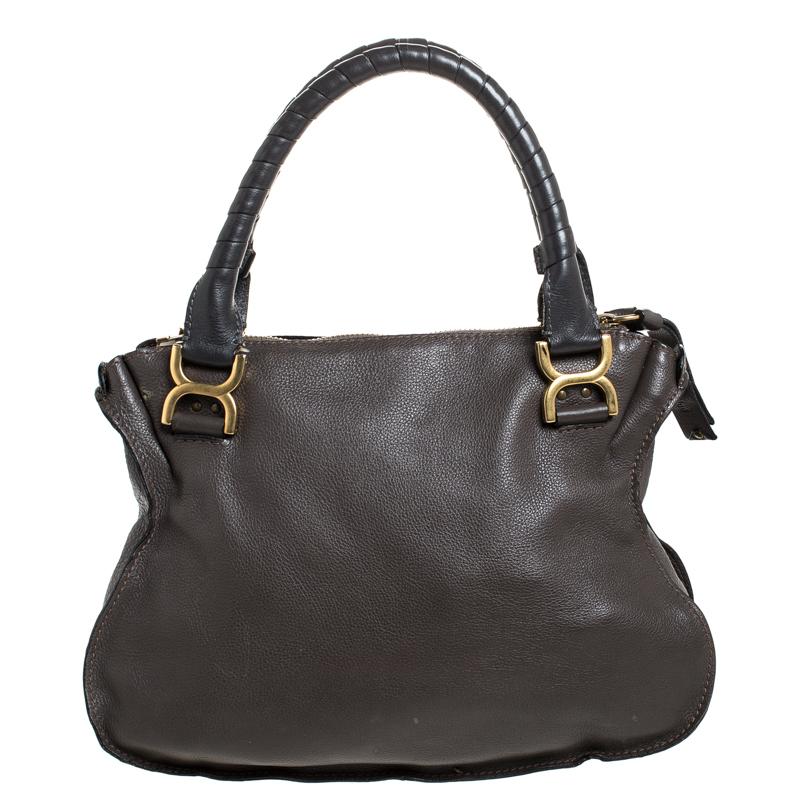 Stunning to look at and durable enough to accompany you wherever you go, this Chloe bag is a joy to own! This Marcie bag is crafted from leather with dual rolled handles. The insides are fabric lined and perfectly sized to carry your belongings.

