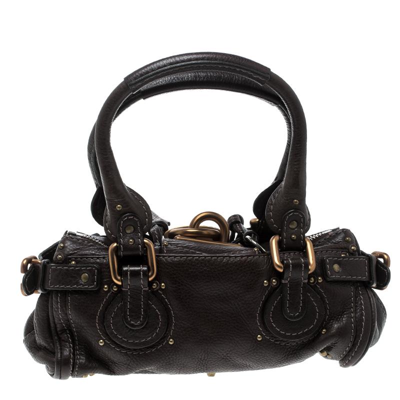 Chloe brings a signature touch to this creation made by the best just for you. Durable and stylish, this leather satchel will take you through your day with ease. The two handles are for you to carry it and the fabric lining makes it perfect to stow