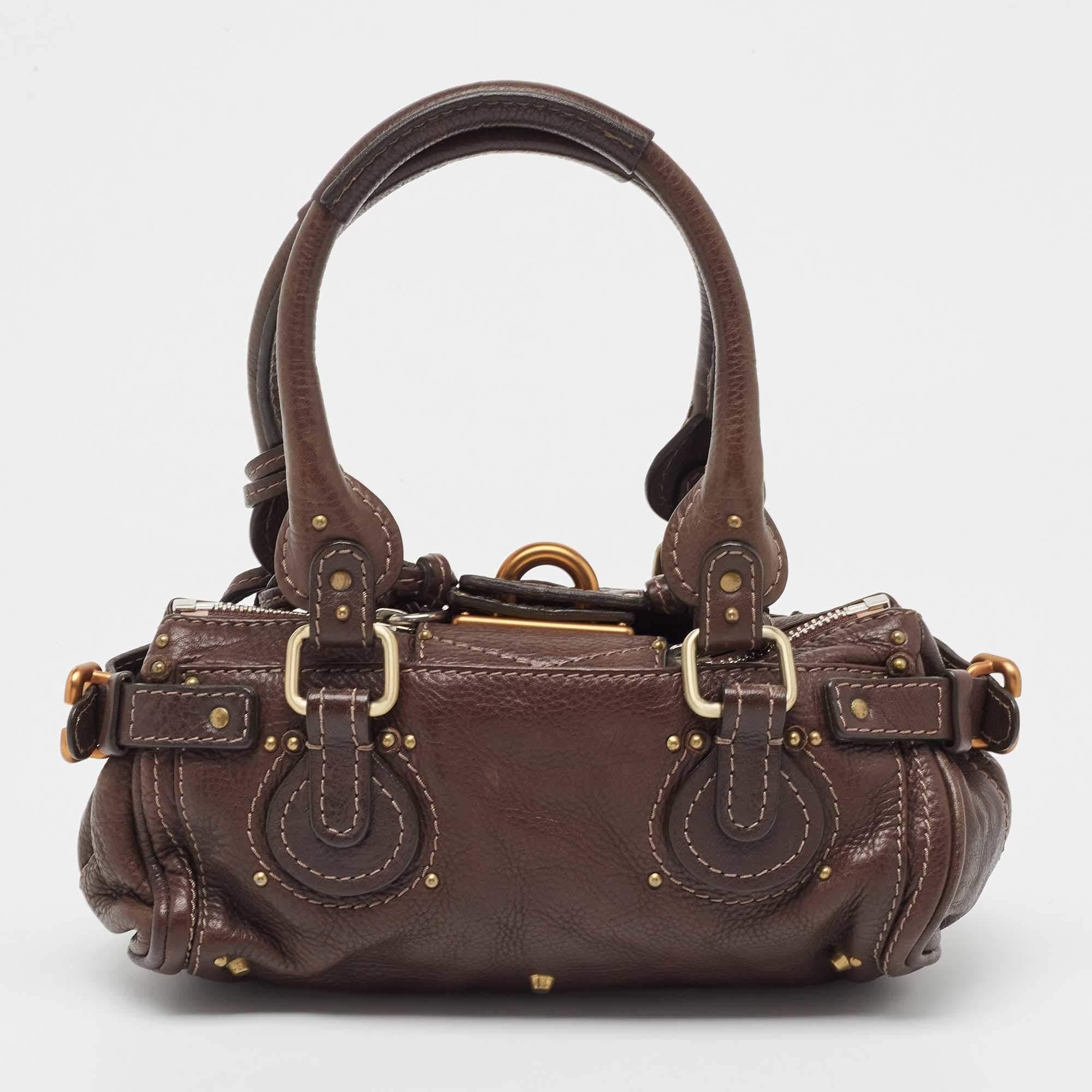 Chloe brings a signature touch to this creation made by the best just for you. Durable and stylish, this leather satchel will take you through your day with ease. The two handles are for you to carry it and the fabric lining makes it perfect to stow