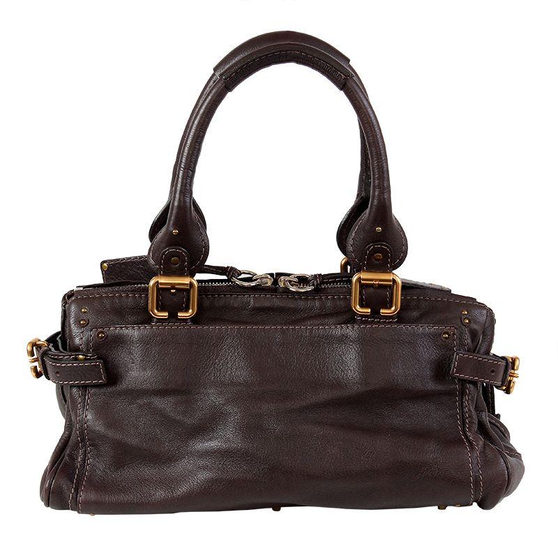 Chloe 'Paddington Capsule Satchel' shoulder bag in dark brown leather with contrasting taupe stitching. Decorative chain and mini lock on the front. Magnetic flap pocket on the front. Open pocket on the outside back. Opens with a zipper on top.