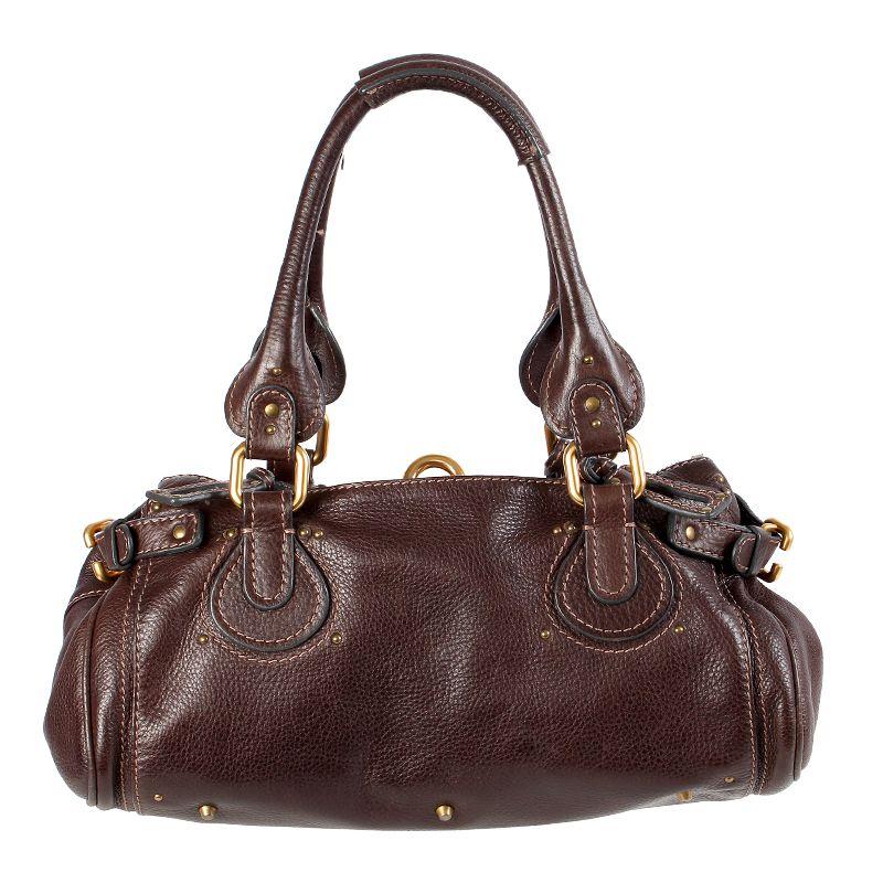 Chloé 'Paddington' shoulder bag in dark brown leather with a lock (comes with key). Open outside pocket on the front and back. Opens with a two-side zipper on top. Lined in dark brown canvas with a zipper pocket against the front and a slip pocket