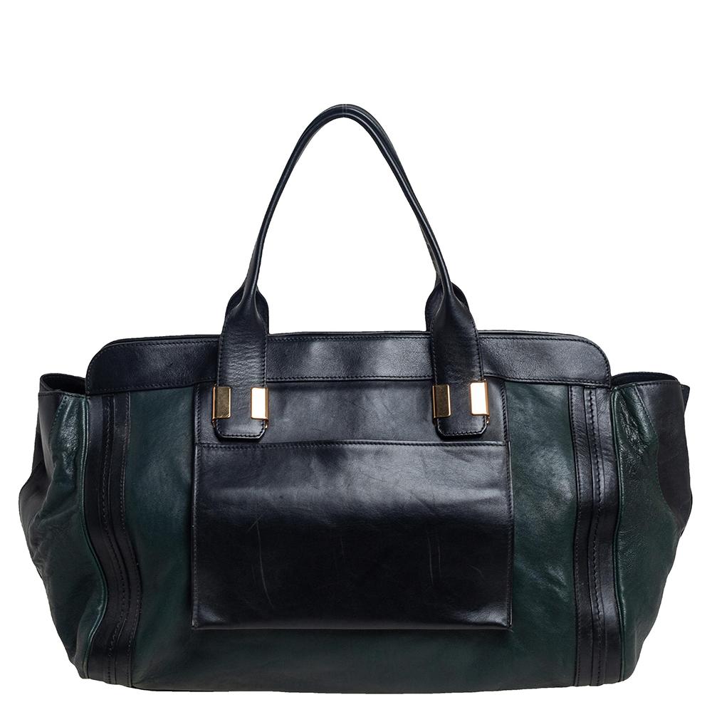 The Alice bag first made its appearance at the Chloe RTW Fall 2012 Runway show. The bag comes in different versions, but they are all chic and high in style. This satchel comes crafted from leather in dark green and black, with the brand label