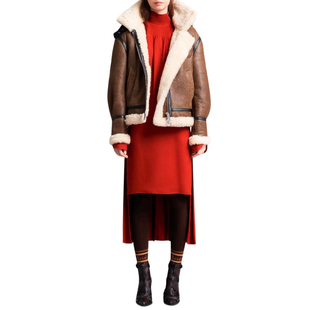 Chloe detachable-hood brown shearling jacket

- Brown, shearling 
- Stand collar, detachable hood, long sleeves
- Brown leather trimmed panels 
- Buckle fastening neck and hem straps 
- Slip pockets 
- Two-way zip fastening 
- Back glossy logo print