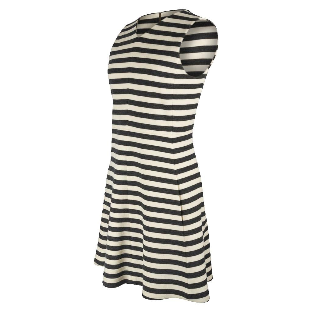 Guaranteed authentic Chloe charcoal and vanilla striped fresh A-line dress. 
Sleeveless with contemporary charcoal and vanilla stripes.
V neckline with low hidden in-seam slash pockets.
Bold rear zip with embossed gold pull. 
Fabric is wool. 
Like