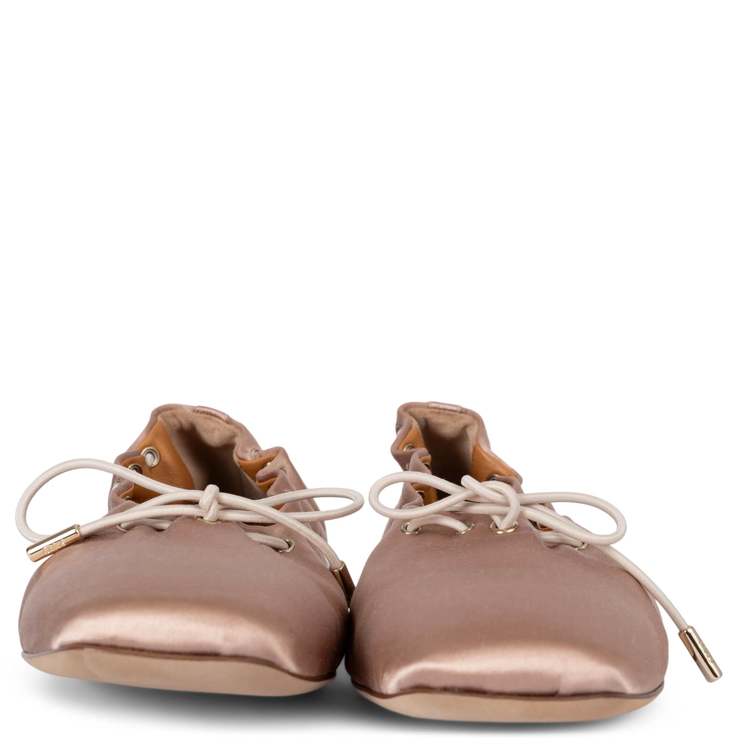 These 100% authentic Chloé Oracia ballet flats in Crystal Pink (dusty rose) smooth satin are inspired by traditional pointe shoes. They feature delicate white leather laces tied in a dainty bow, square toes, and a miniature heel for a graceful and