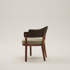 Chloe is a solid ash chair wrapped with a wraparound back.