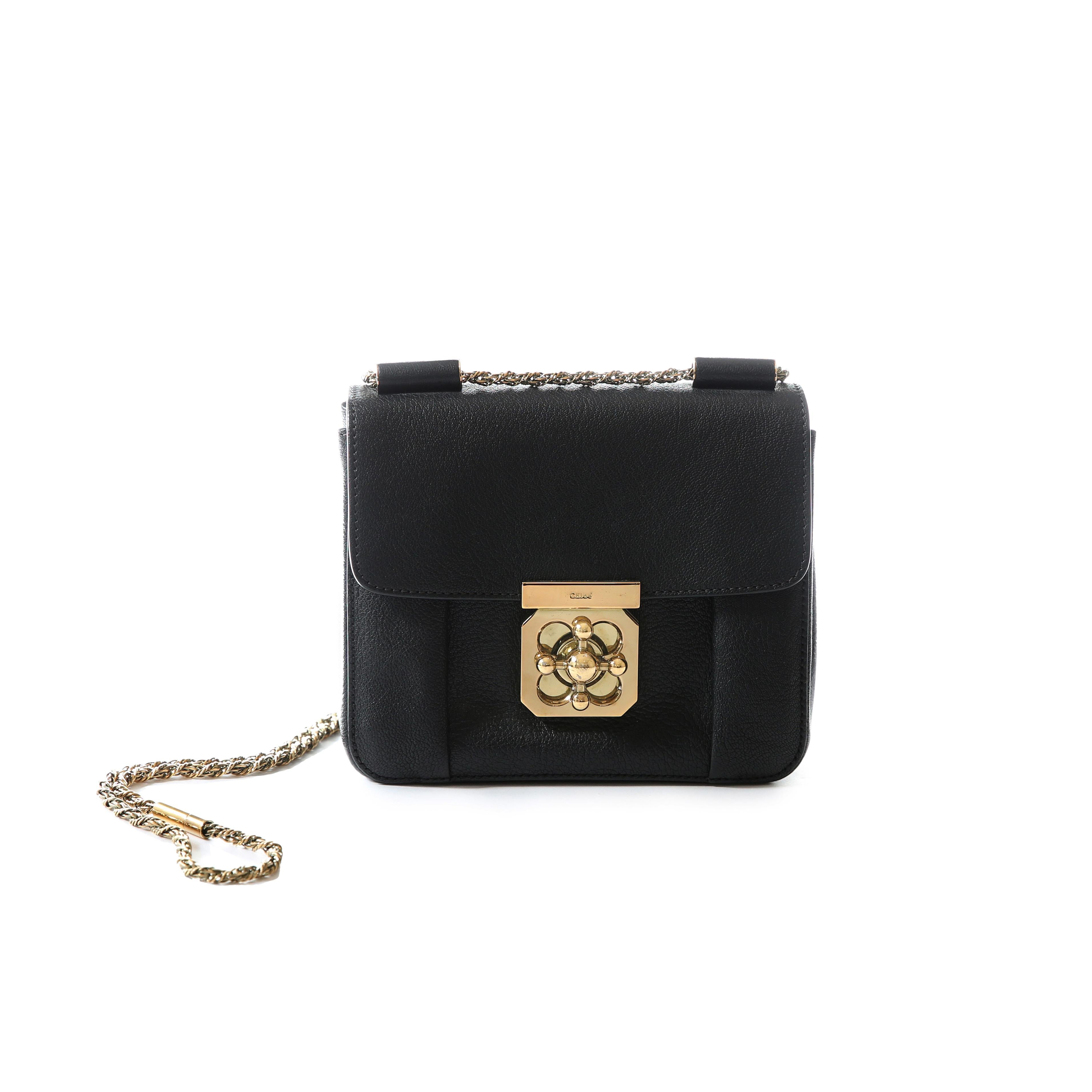 LOVE LALI Vintage

Chloe Elise bag in black
Grained leather
Long twisted gold chain shoulder strap - can be worn doubled or at full length or tucked inside the bag 
Gold twist dial closure
1 inside pocket

Condition:
Fine surface scratches to the