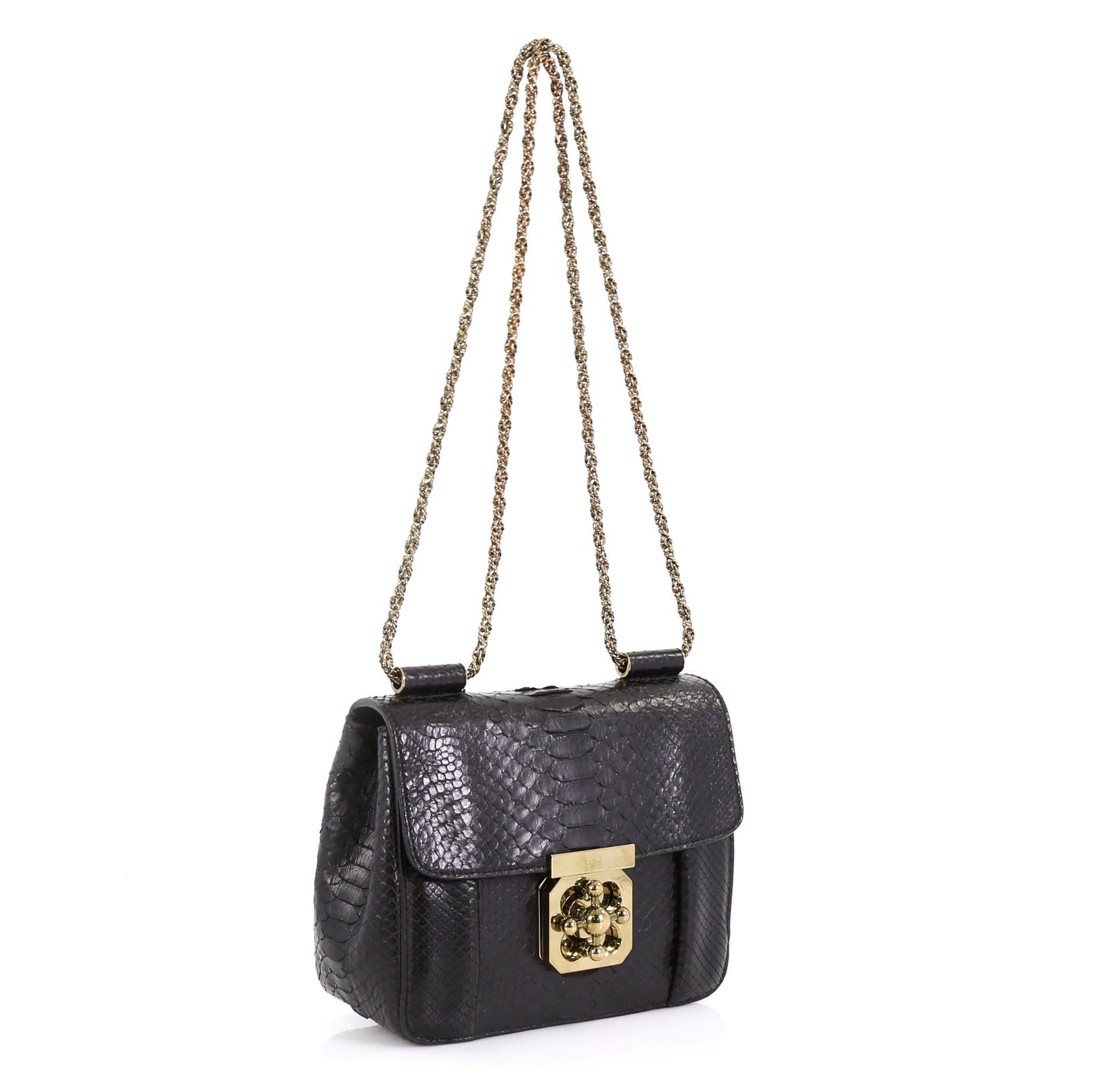 This Chloe Elsie Chain Shoulder Bag Python Small, crafted from genuine black python, features chain link strap and gold-tone hardware. Its floral turn-lock closure opens to a black leather interior with slip pocket. This item can only be shipped
