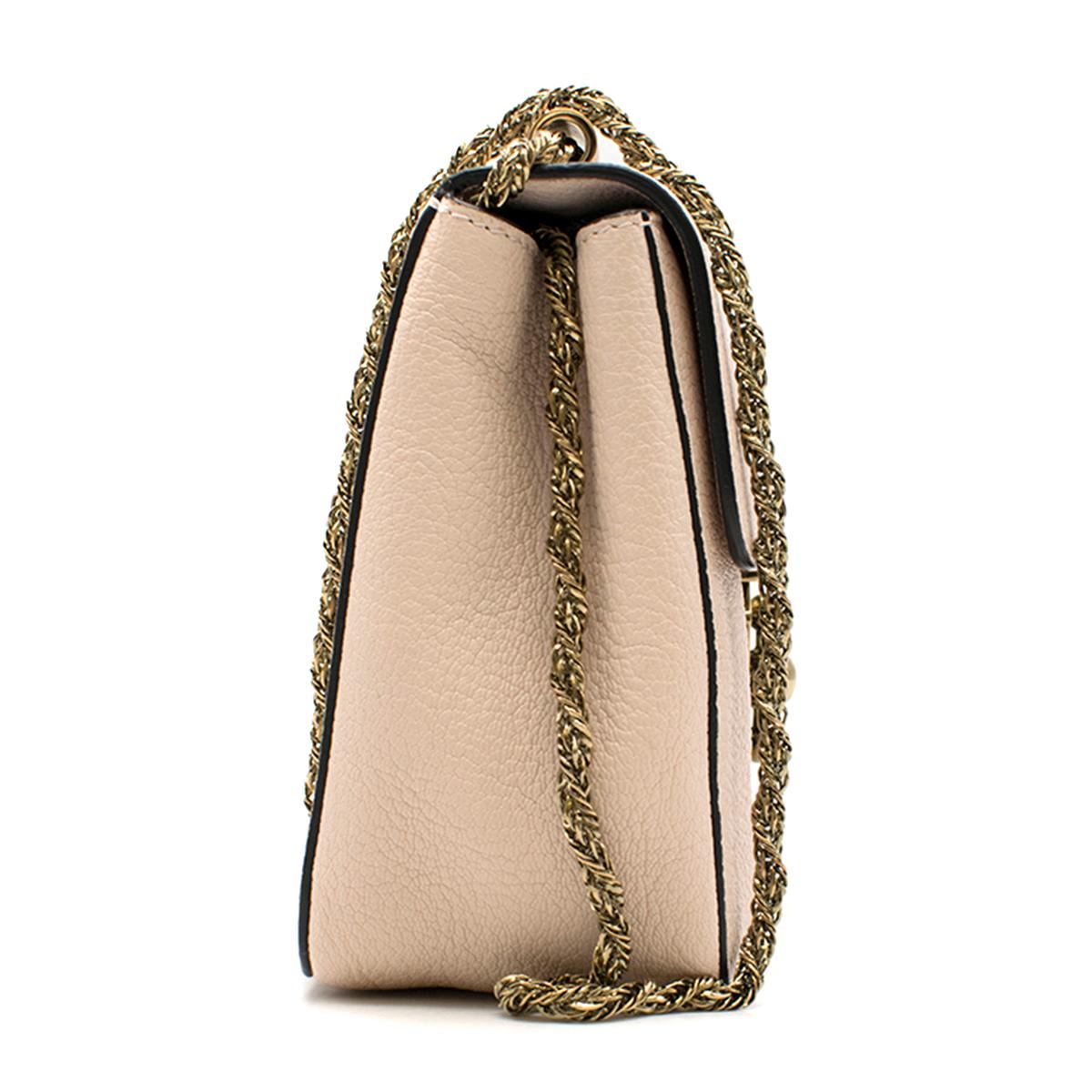 Chloe Elsie Leather Crossbody Bag

- Nude pink grained leather crossbody bag
- Front twist lock fastening with logo engraved
- Flap opening
- Internal soft leather lining
- Internal patch pocket
- Shoulder strap chain
- Gold-tone hardware
- This
