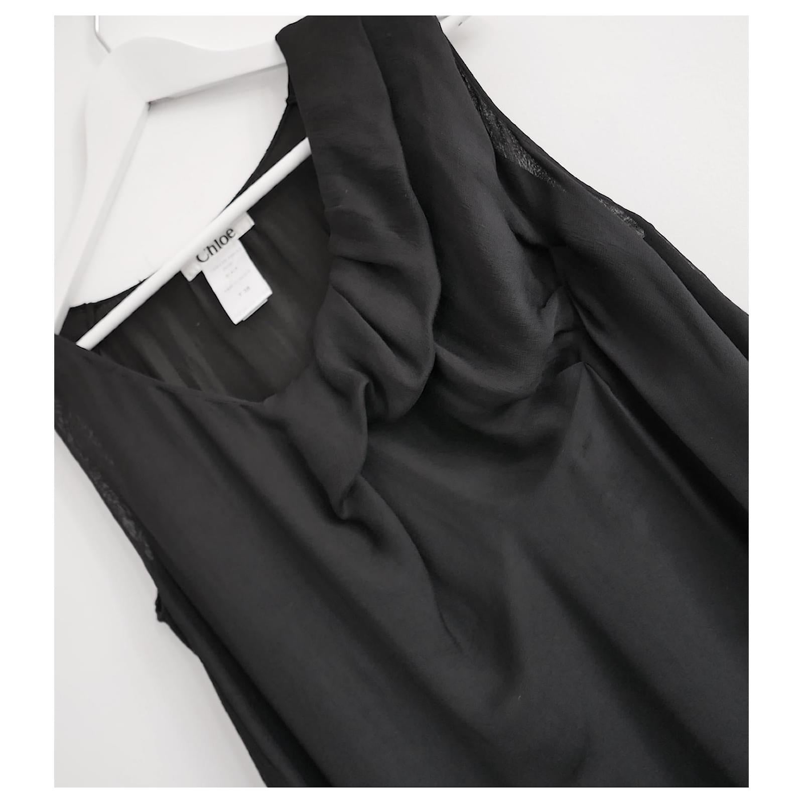 Gorgeous archival Chloe black dress from the Fall 2007 Collection. Made from 3 layers of soft black silk chiffon with soft ribbed jersey panel to the back. It has soft draping to the front and a relaxed, Loose fit. Size FR38/UK10 and will fit