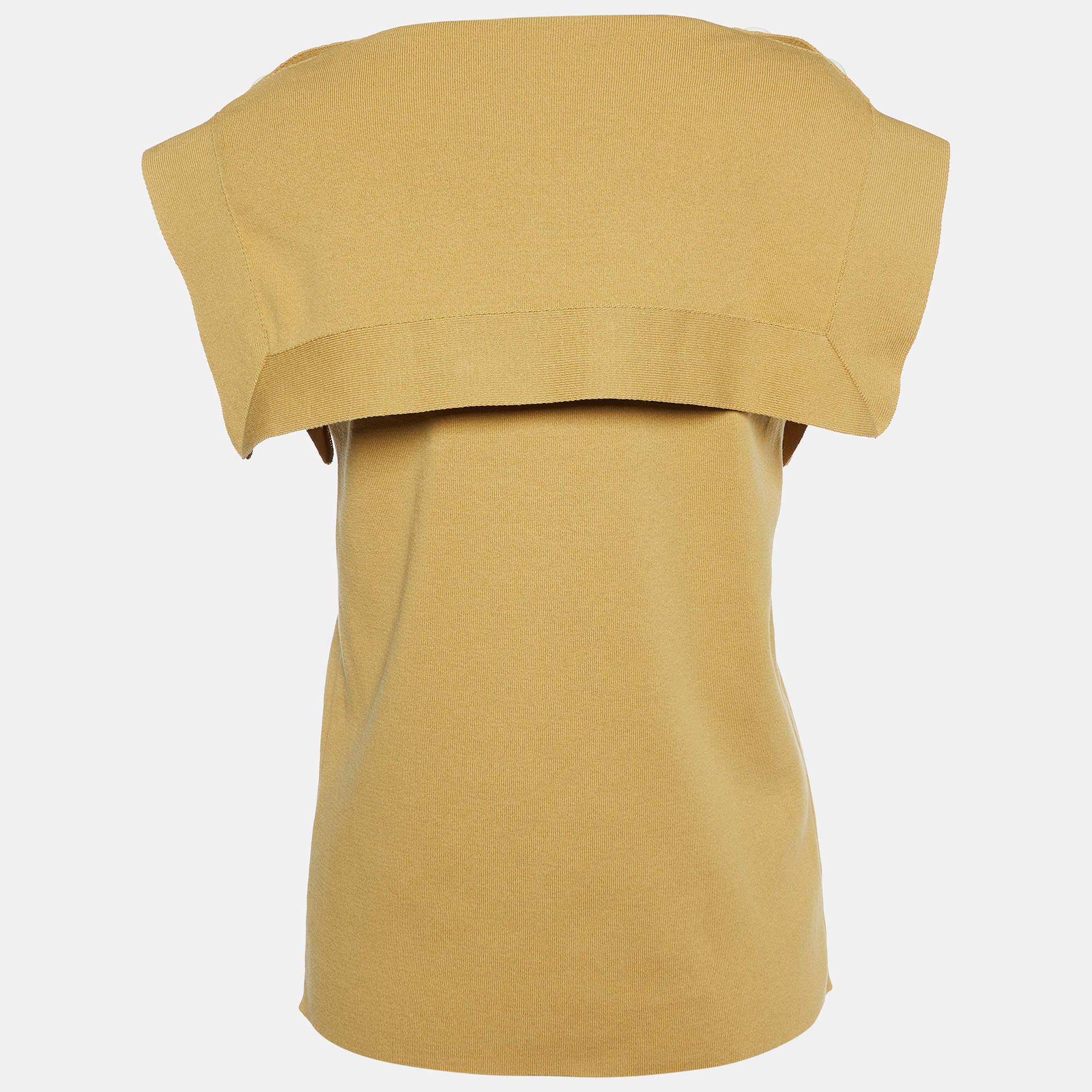Questo top griffato offre stile e comfort. Realizzata con i migliori tessuti, la creazione è stata curata nei minimi dettagli. Abbinalo a una gonna e a dei tacchi.