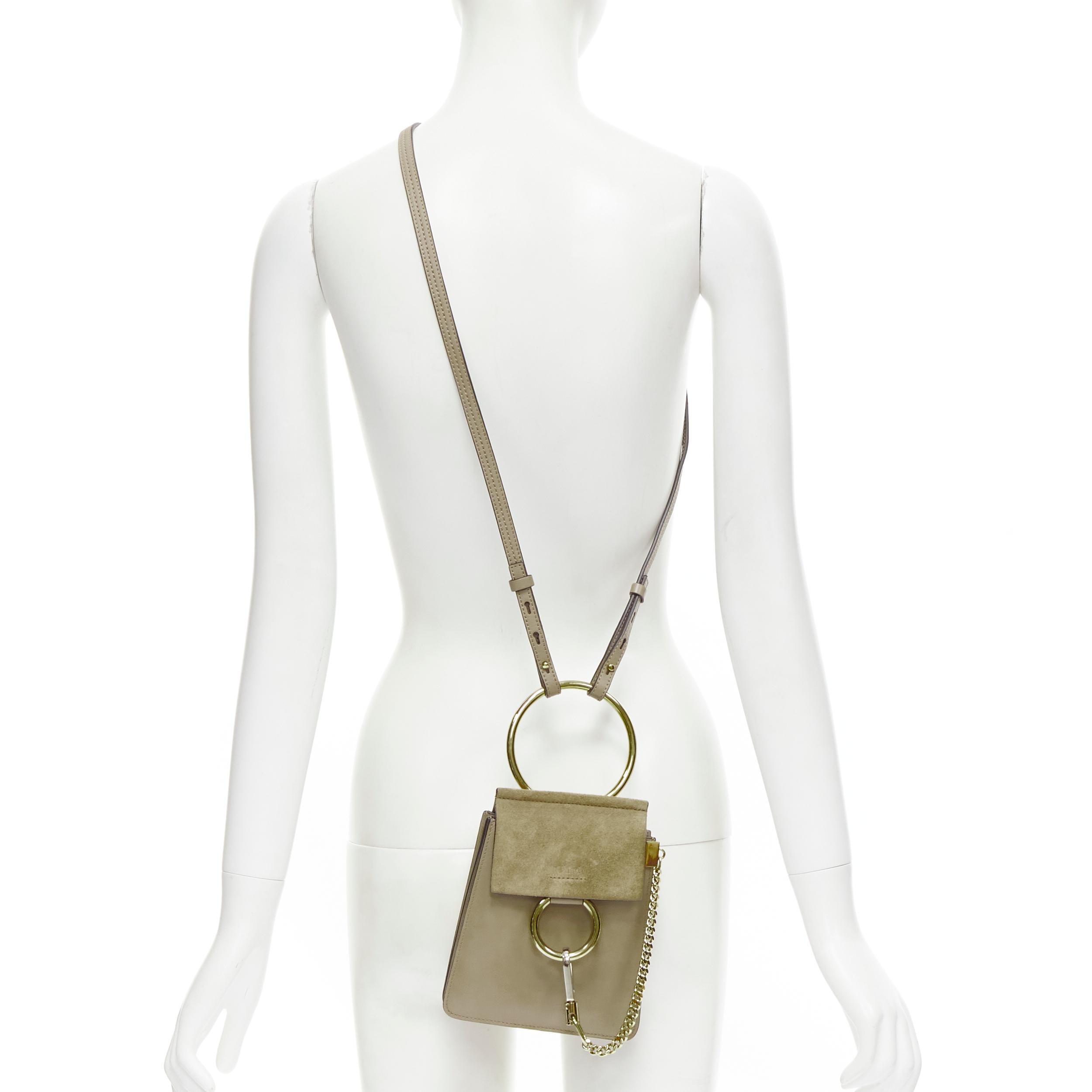 CHLOE Faye gold bangle bracelet ring chained crossbody grey suede leather bag 
Reference: JECN/A00020 
Brand: Chloe 
Model: CHC17WS320H2O23W 
Material: Suede 
Color: Grey 
Pattern: Solid 
Closure: Button 
Estimated Retail Price: US $1110 
Made in: