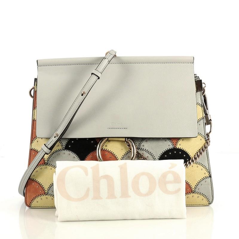 This Chloe Faye Patchwork Shoulder Bag Studded Leather with Suede Medium, crafted in blue leather with multicolor suede, features an adjustable leather strap, chain and ring closure, patchwork with stud detailing, and gold-tone hardware. Its hidden