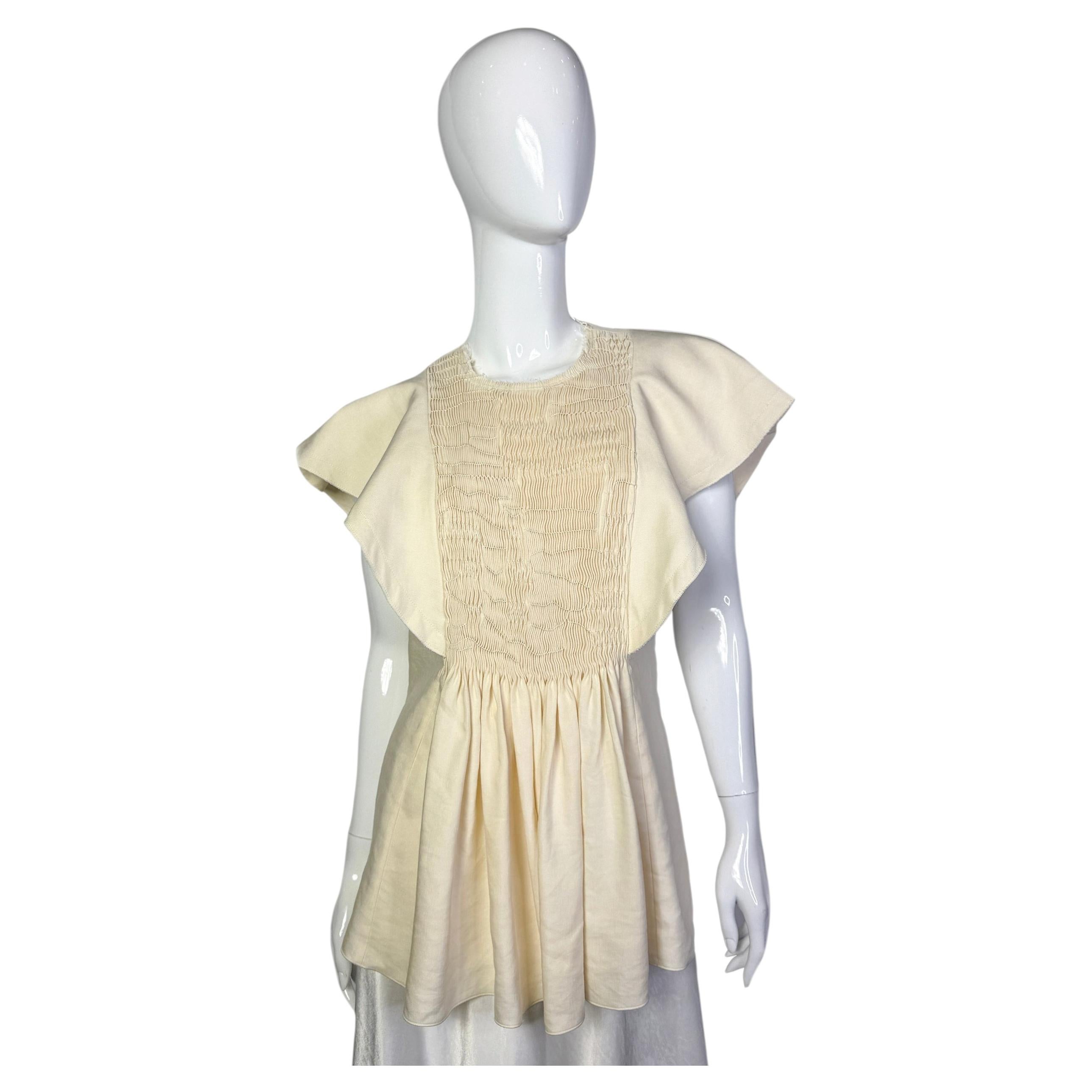 Top de manga volante Chloe en venta