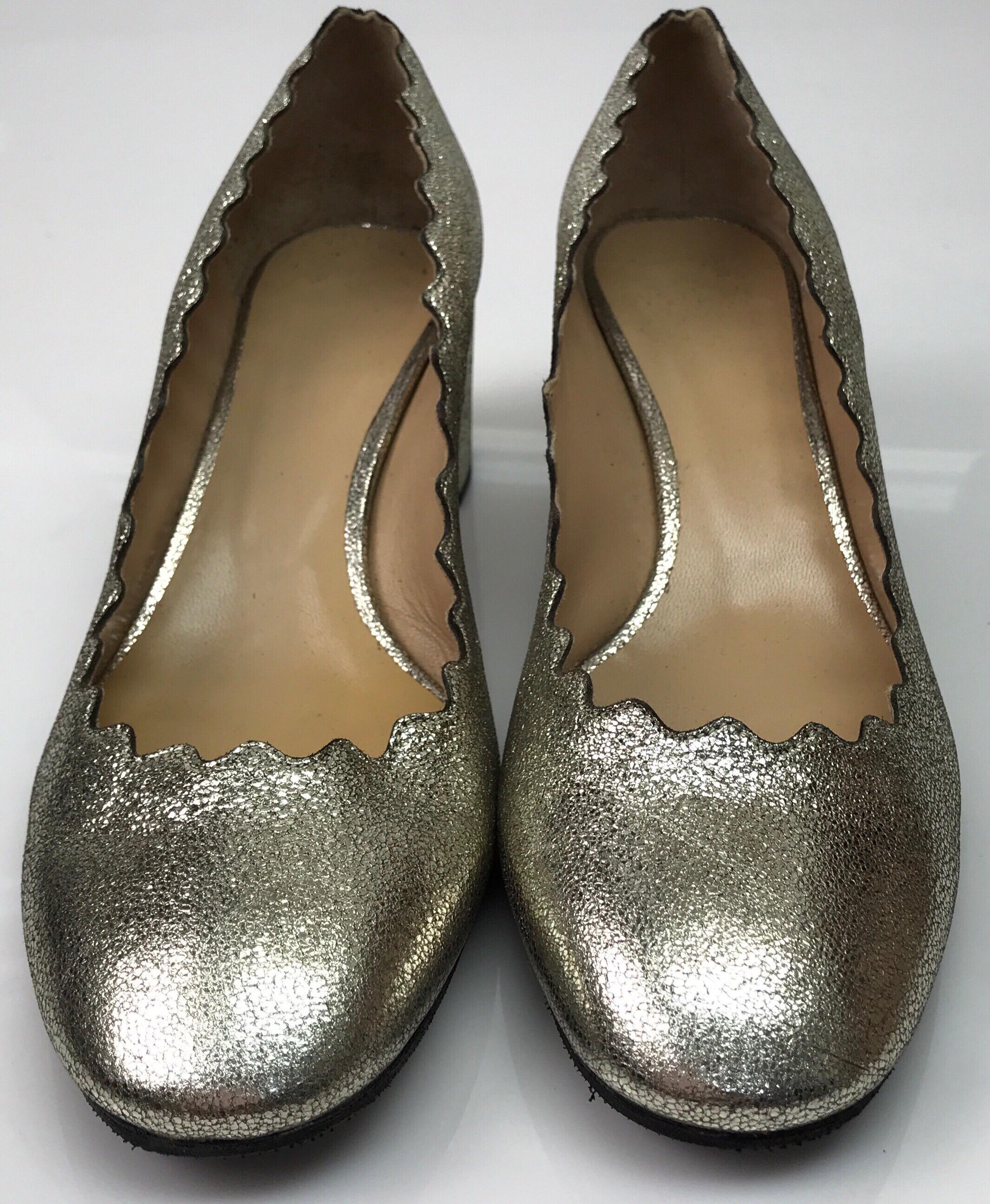 Chloe Gold Block Heel w/ Scalloped Edge- 39. These stunning Chloe heels are in good condition. The inside has some stains on the heel and the bottoms of the shoes have been replaced. The heels are made of a gold metallic leather. It has a block heel