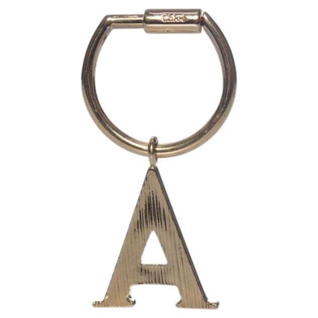 Chloe, gold metal pendant For Sale